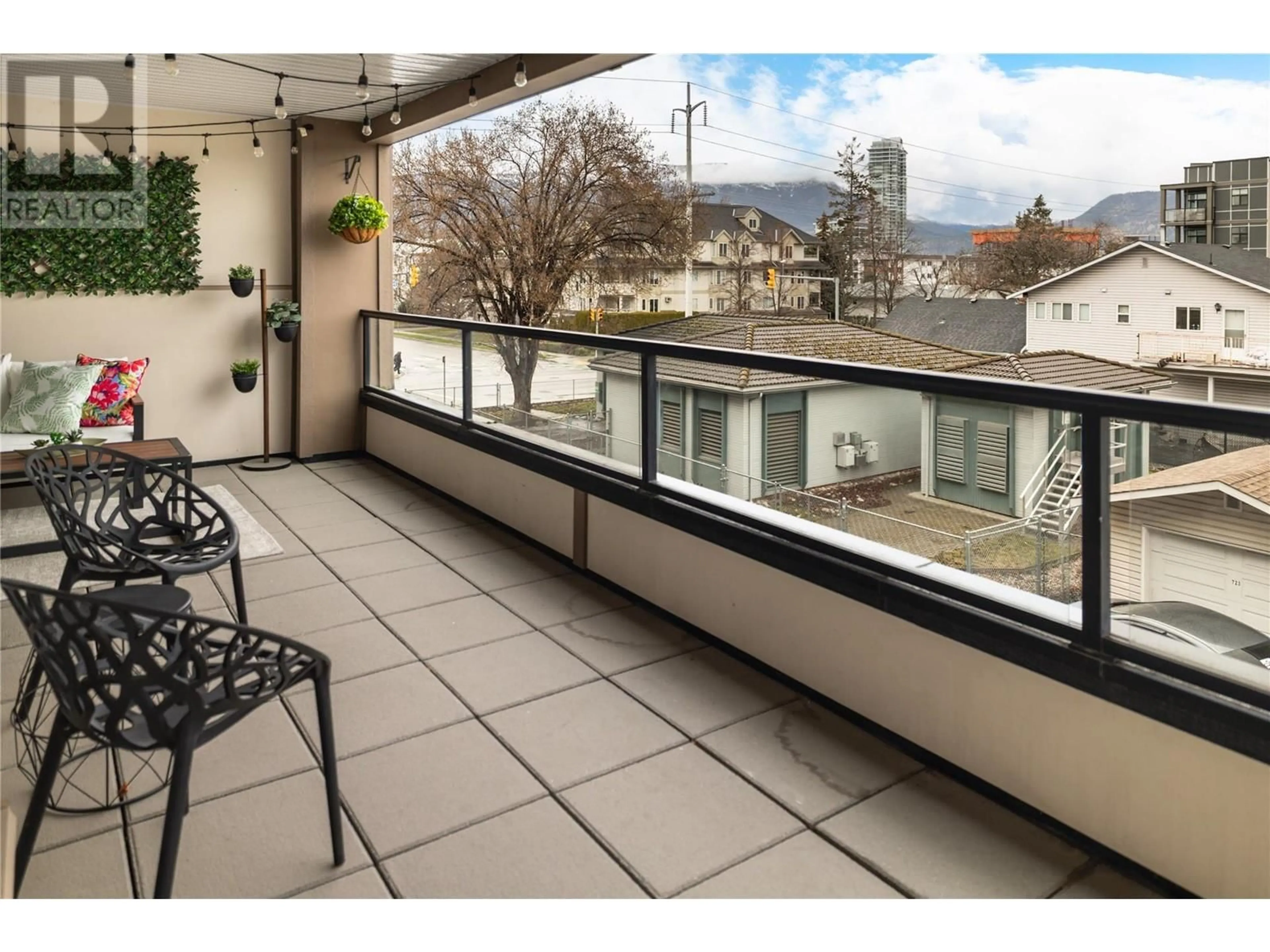 Balcony in the apartment, city buildings view from balcony for 207 - 700 MARTIN AVENUE, Kelowna British Columbia V1Y6V4