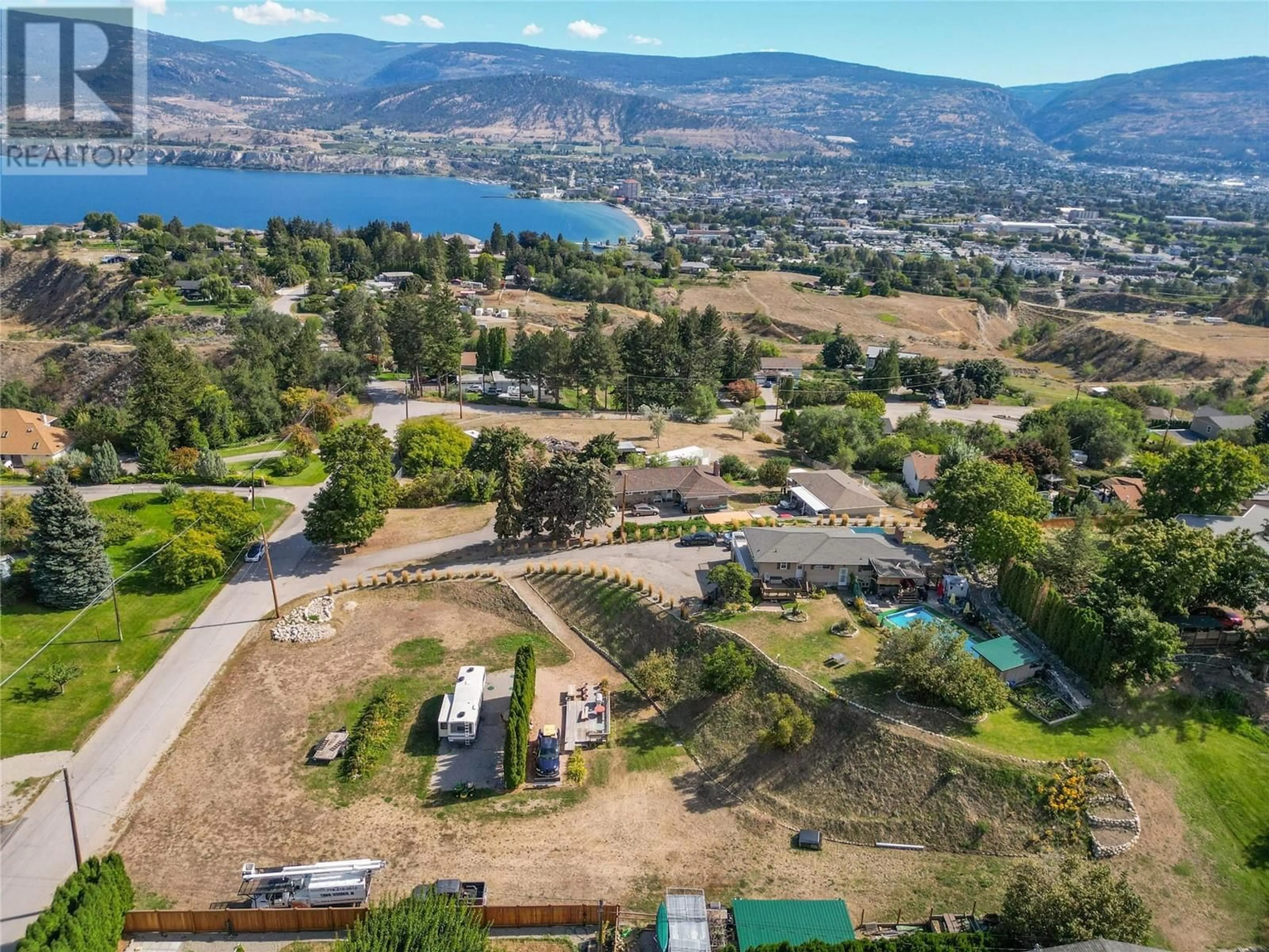 A pic from outside/outdoor area/front of a property/back of a property/a pic from drone, mountain view for 903 NEWTON DRIVE, Penticton British Columbia V2A8Z4