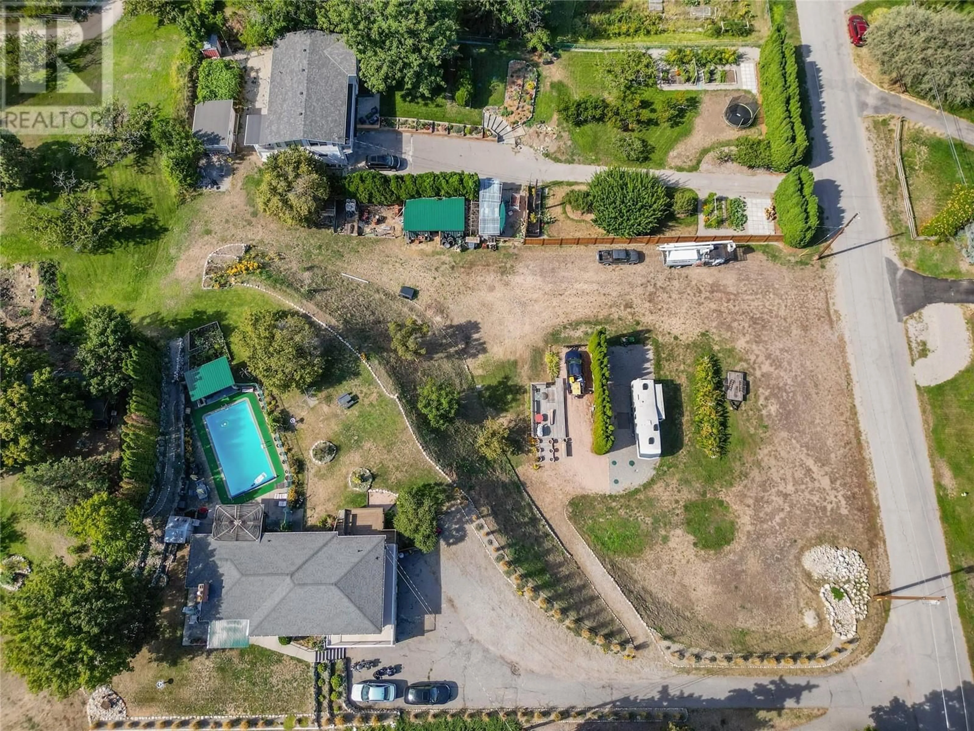A pic from outside/outdoor area/front of a property/back of a property/a pic from drone, street for 903 NEWTON DRIVE, Penticton British Columbia V2A8Z4