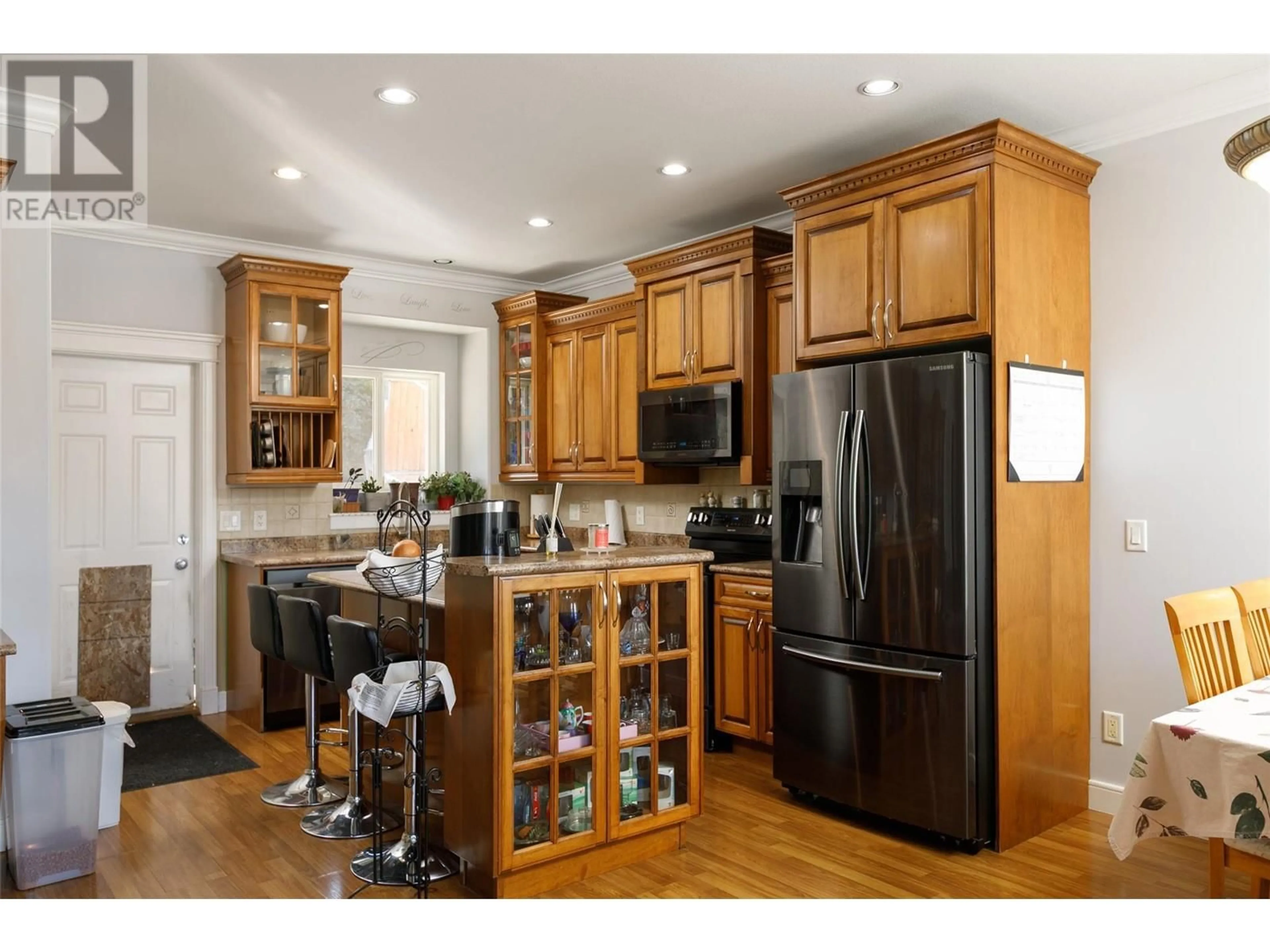 Open concept kitchen, wood/laminate floor for 1595 KLOPPENBURG ROAD, Kelowna British Columbia V1P1N5