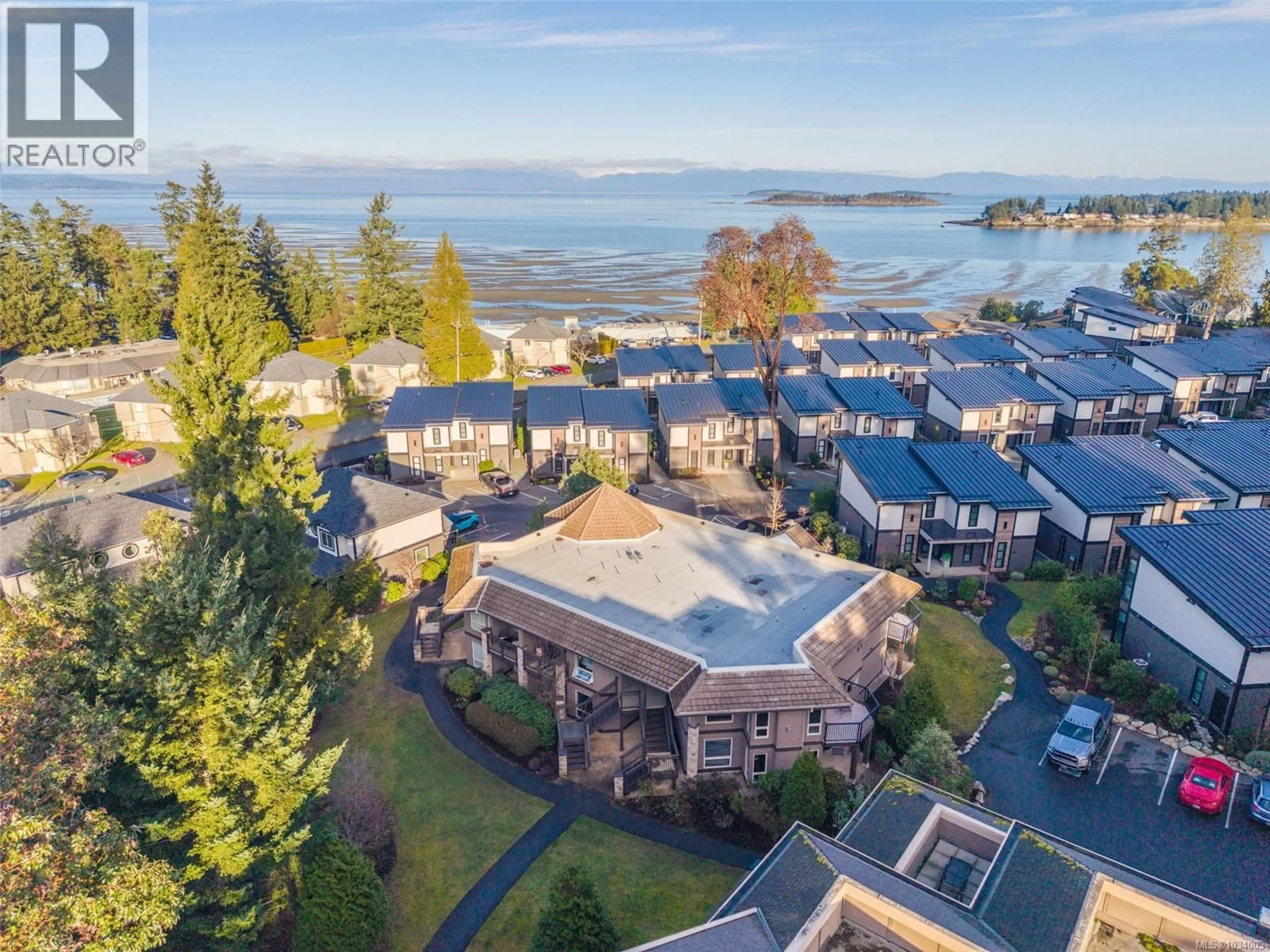 A pic from outside/outdoor area/front of a property/back of a property/a pic from drone, water/lake/river/ocean view for 421 - 1175 RESORT DRIVE, Parksville British Columbia V9P2E3