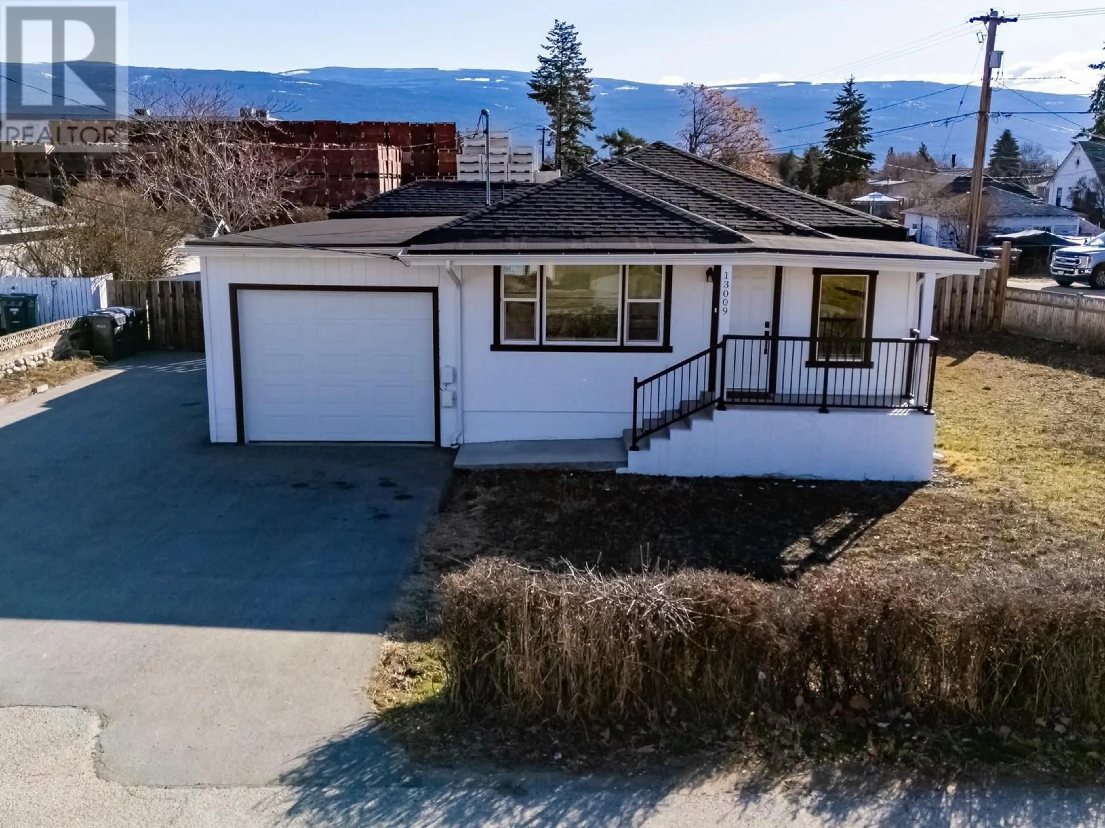 A pic from outside/outdoor area/front of a property/back of a property/a pic from drone, unknown for 13009 ARMSTRONG AVENUE, Summerland British Columbia V0H1Z3
