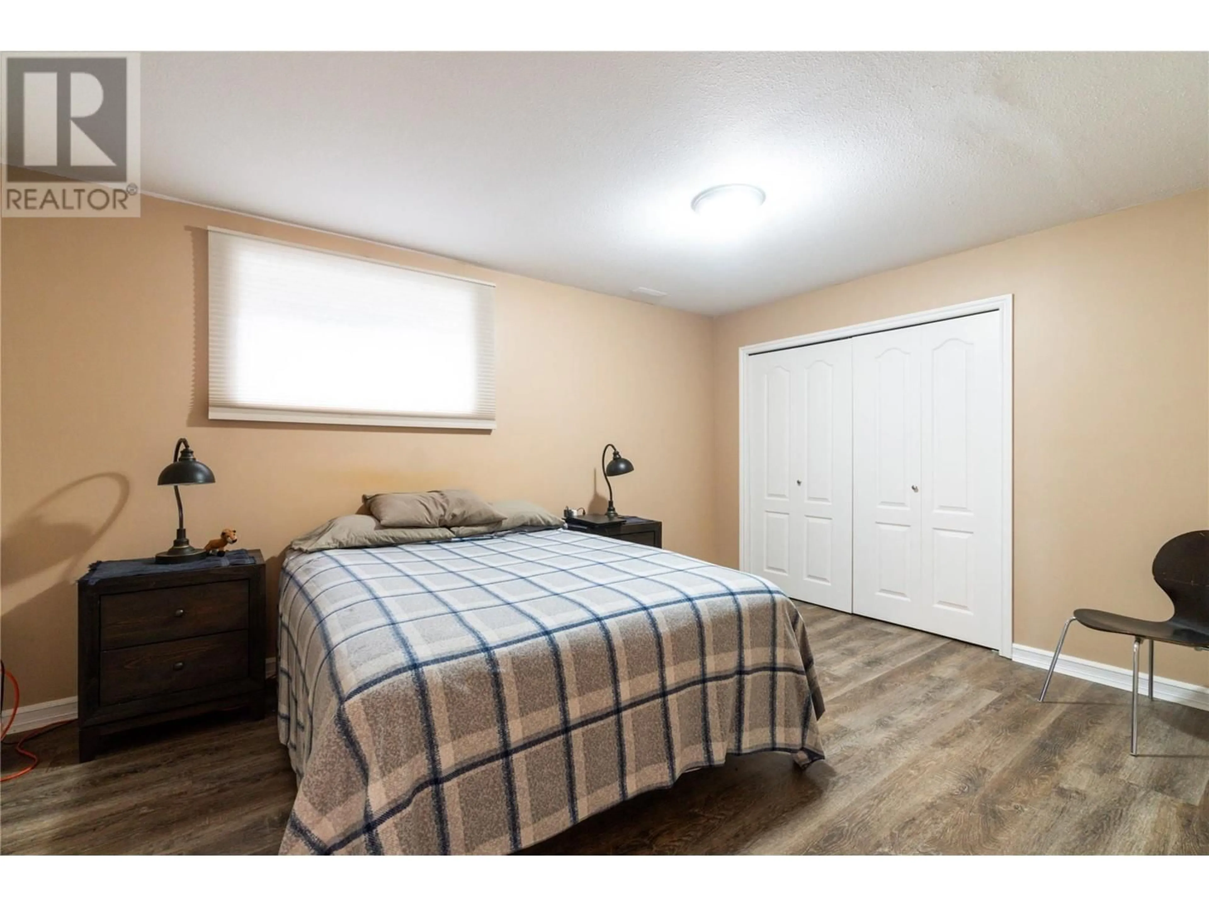 Bedroom with bed, wood/laminate floor for 4480 LAKESHORE ROAD NORTHEAST, Salmon Arm British Columbia V1E3N6