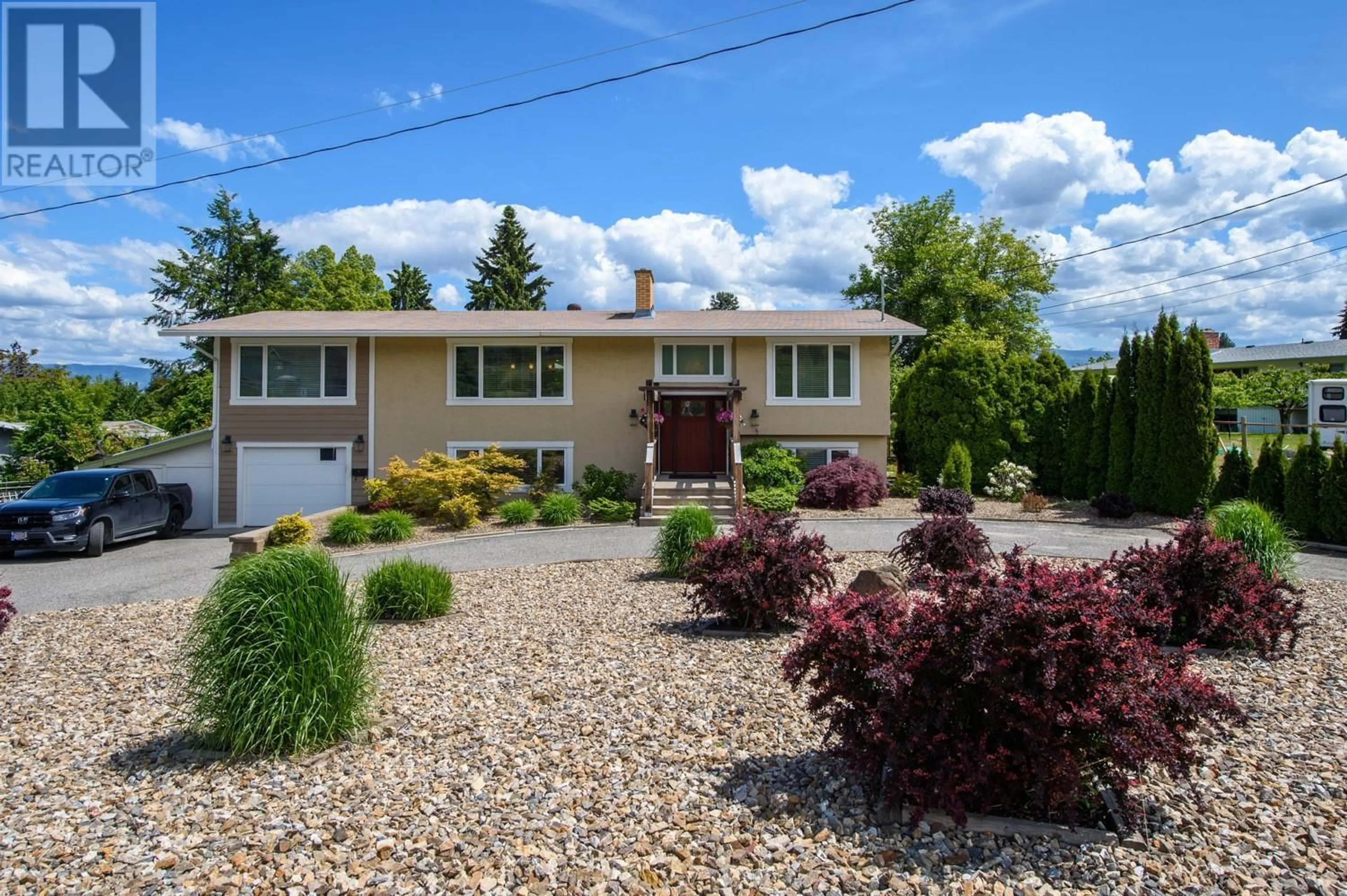 Home with vinyl exterior material, street for 2475 HAYMAN ROAD, West Kelowna British Columbia V1Z2A1