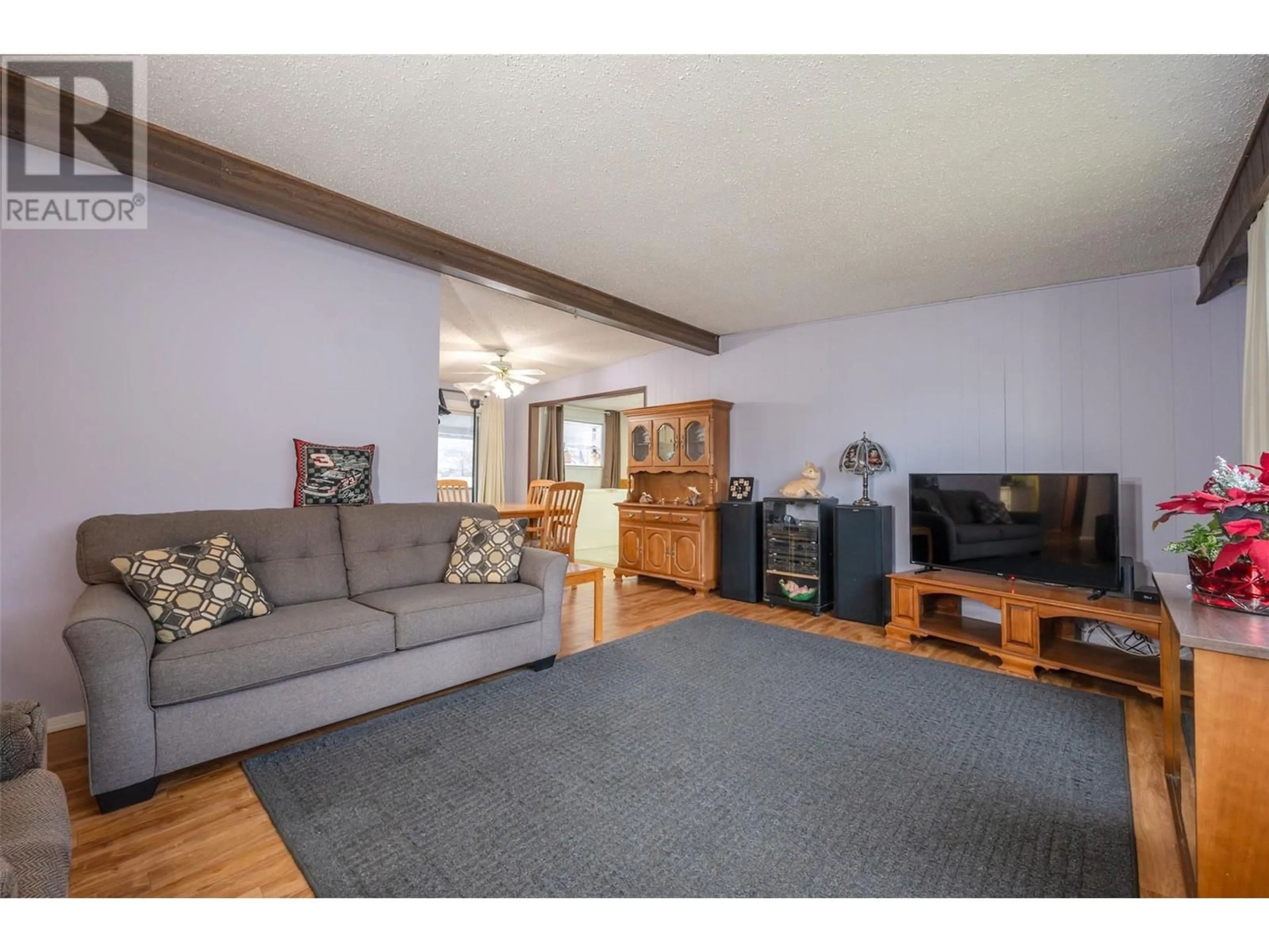 Living room with furniture, wood/laminate floor for 824 BIRCH STREET, Okanagan Falls British Columbia V0H1R0