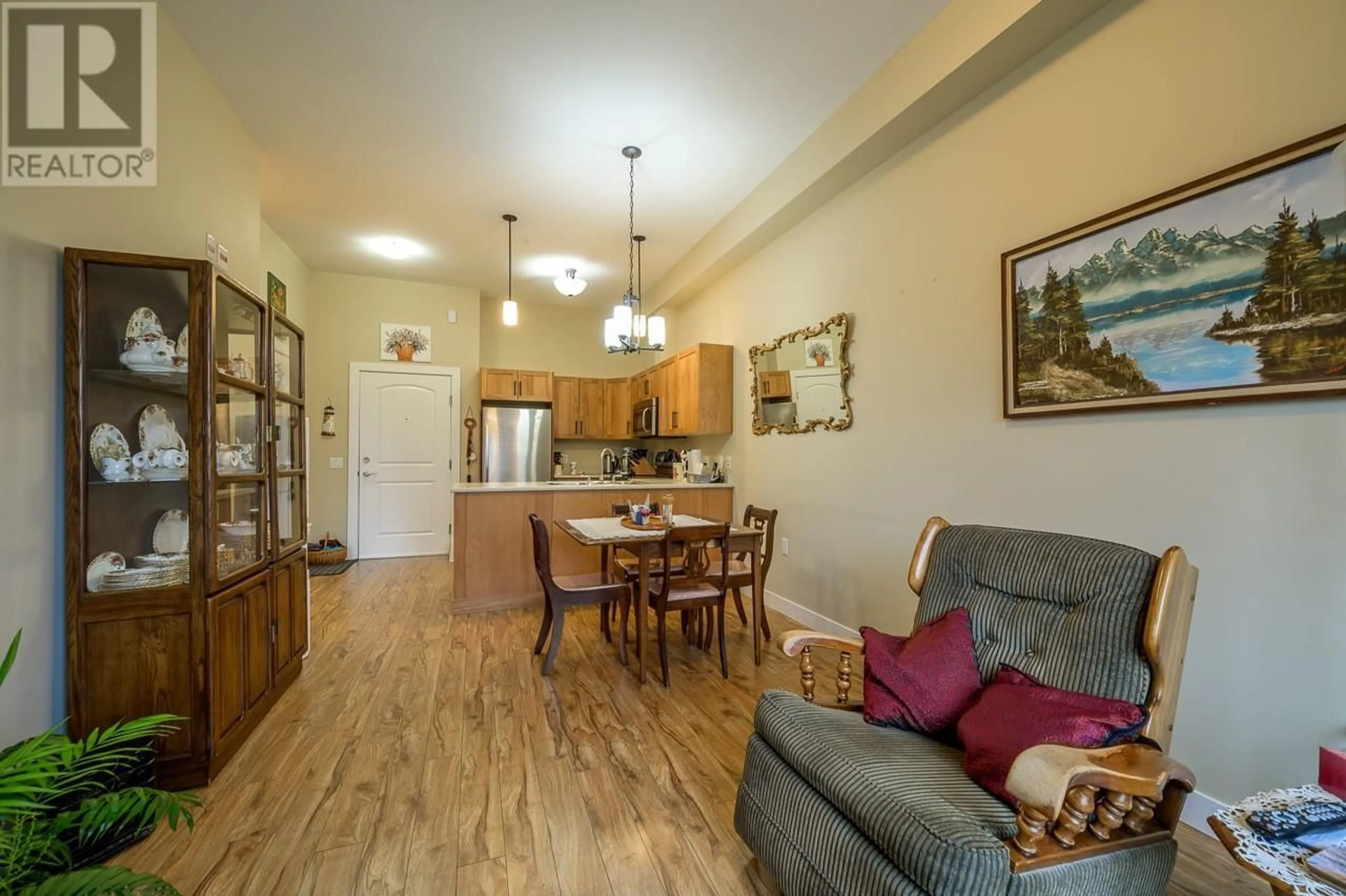 Living room with furniture, wood/laminate floor for 110 - 755 MAYFAIR STREET, Kamloops British Columbia V2B5L7