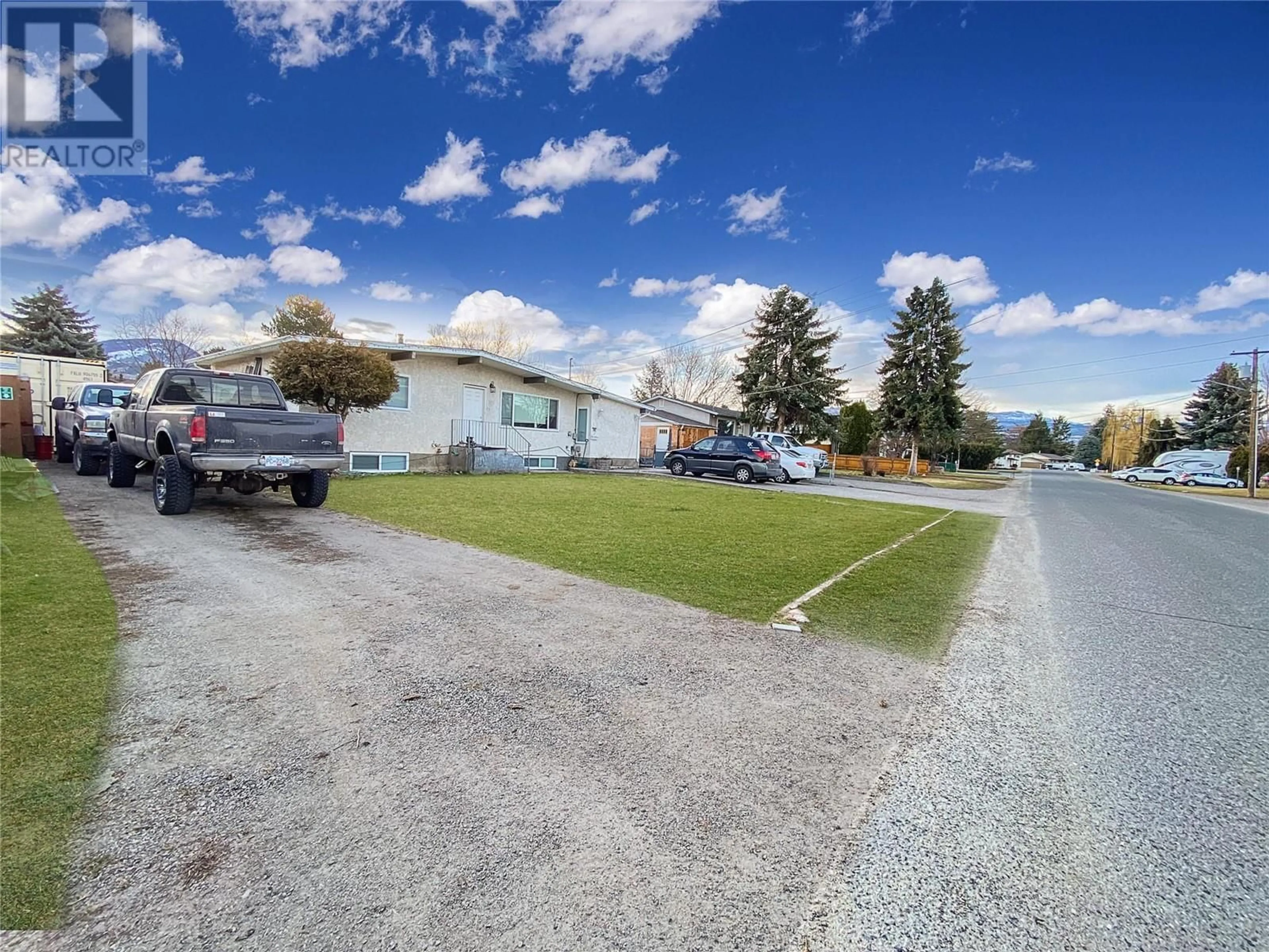 A pic from outside/outdoor area/front of a property/back of a property/a pic from drone, street for 195 Davie Road S, Kelowna British Columbia V1X3Y6