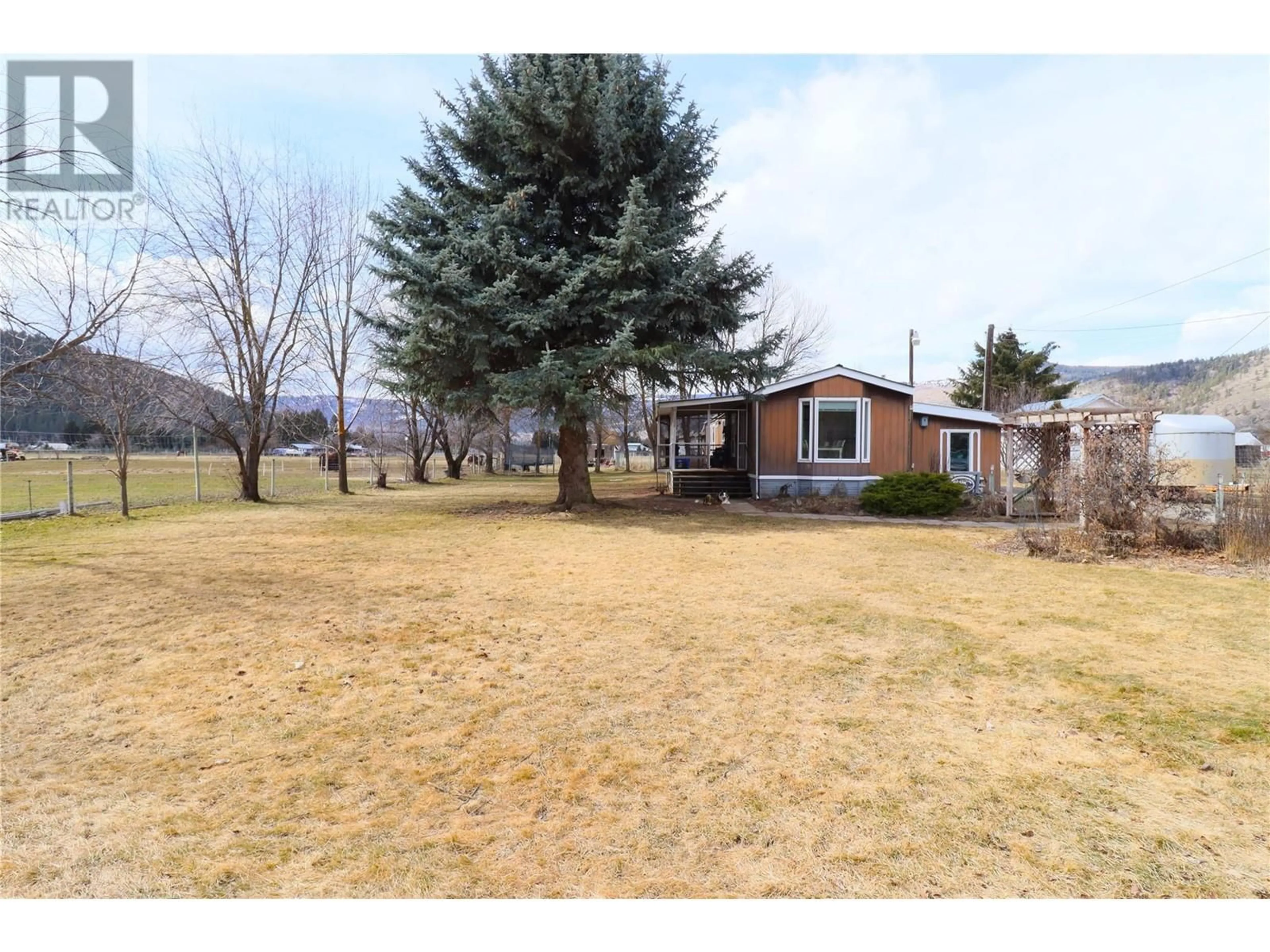 A pic from outside/outdoor area/front of a property/back of a property/a pic from drone, unknown for 5595 COOPER ROAD, Grand Forks British Columbia V0H1H4