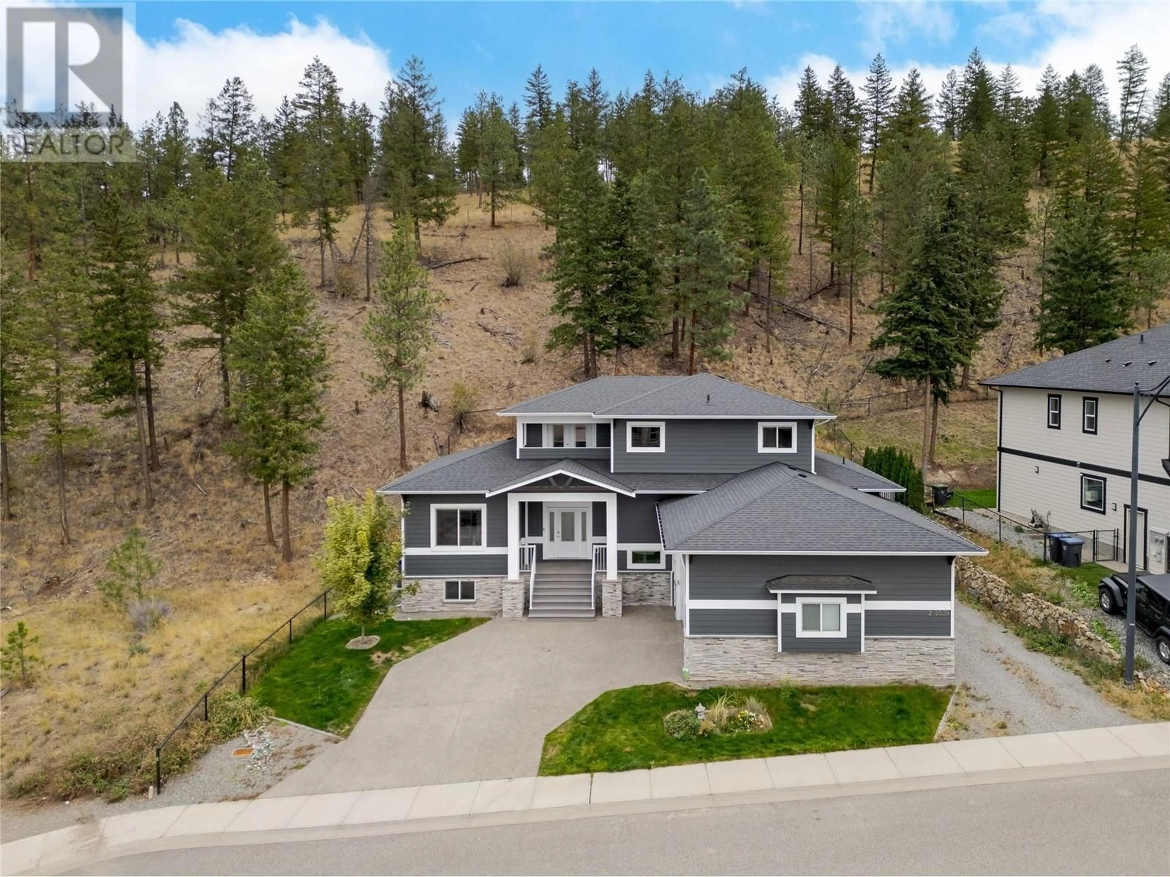 A pic from outside/outdoor area/front of a property/back of a property/a pic from drone, street for 2539 Loseth Road, Kelowna British Columbia V1P1S6