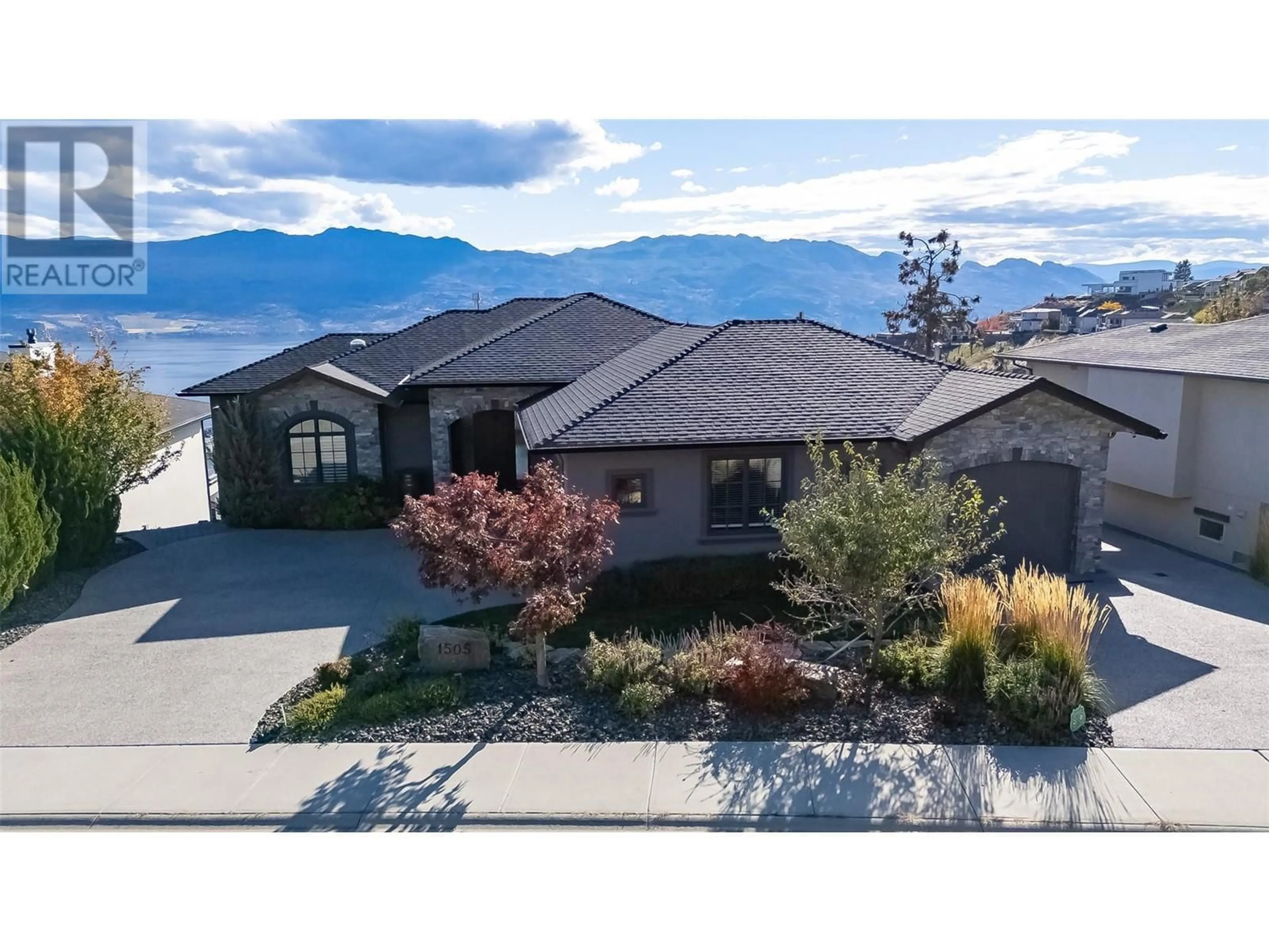 A pic from outside/outdoor area/front of a property/back of a property/a pic from drone, mountain view for 1505 PINOT NOIR DRIVE, West Kelowna British Columbia V4T3B4