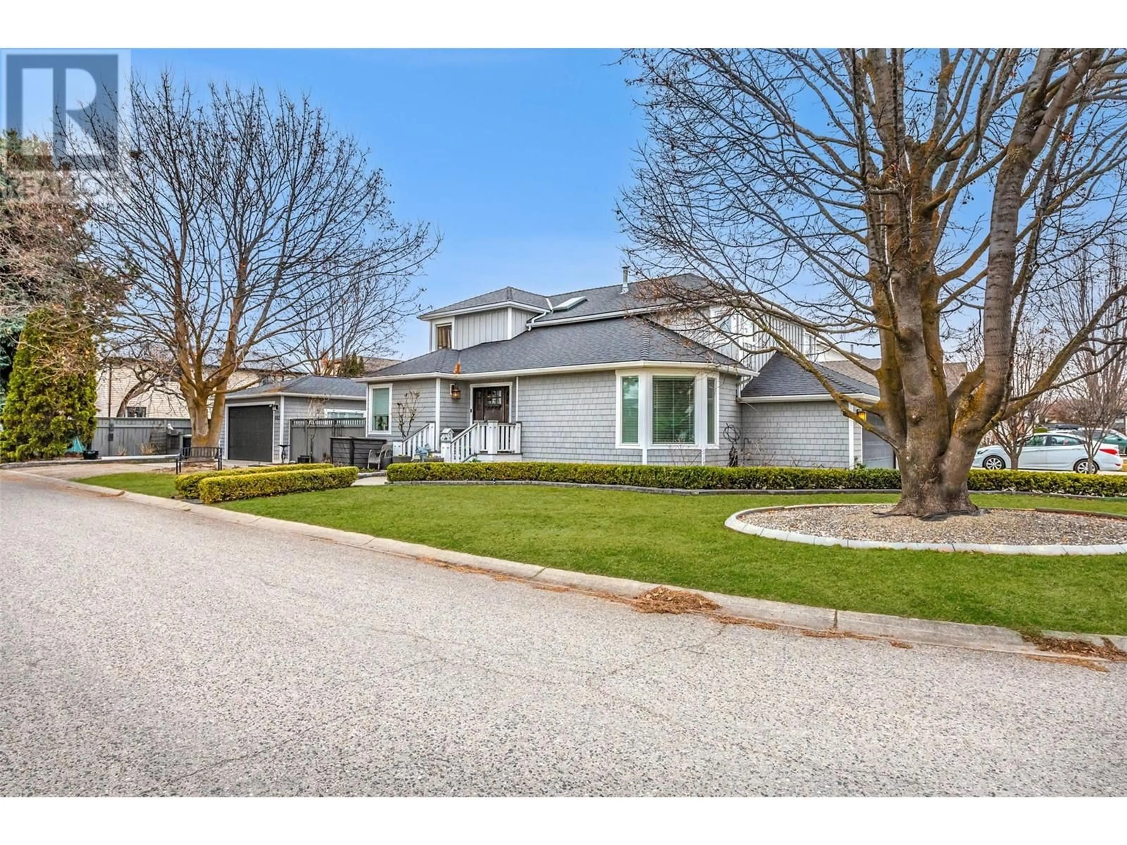 Home with vinyl exterior material, street for 682 SOUTHWIND DRIVE, Kelowna British Columbia V1W3G1
