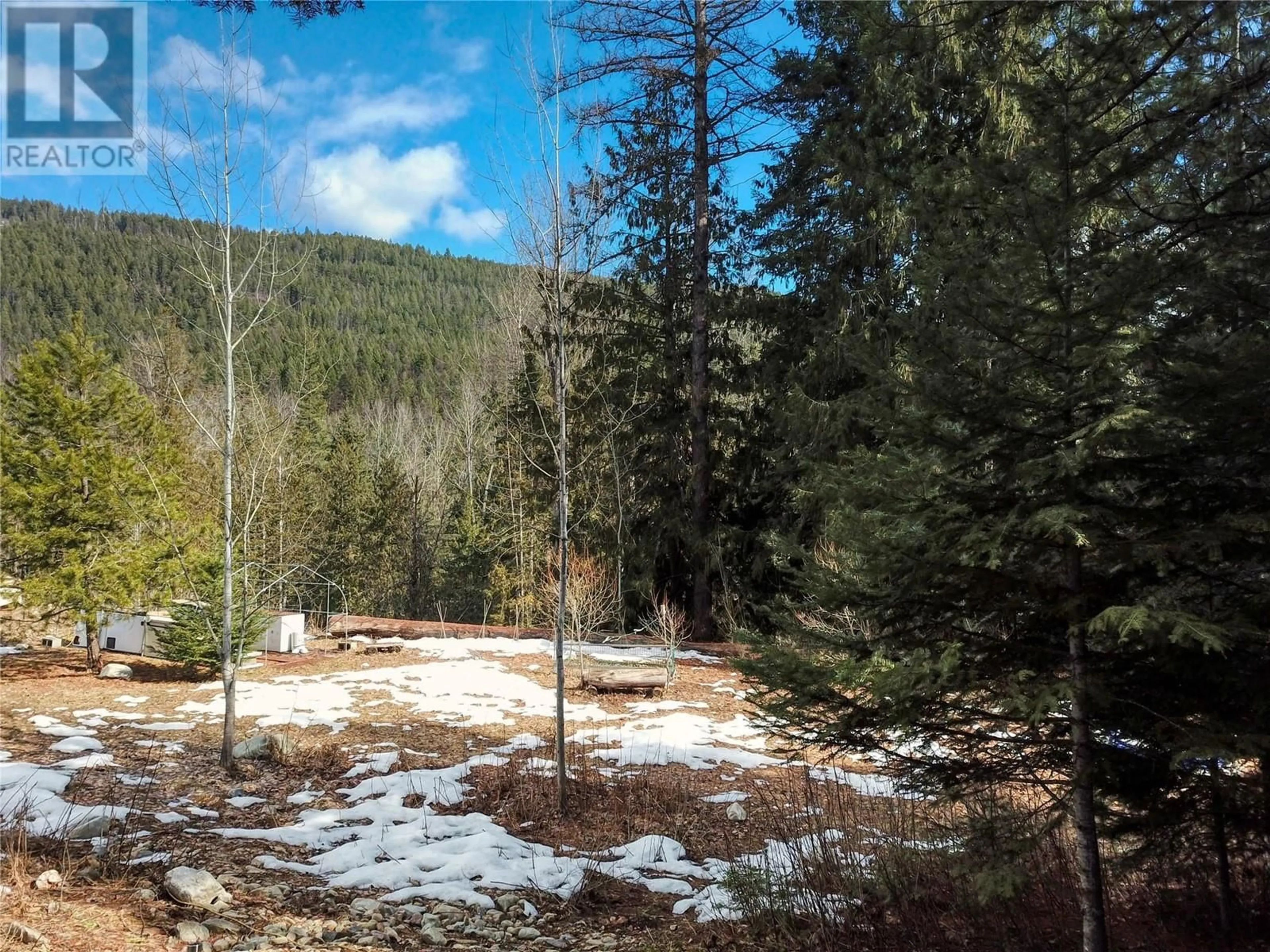 A pic from outside/outdoor area/front of a property/back of a property/a pic from drone, forest/trees view for 1502 WENGER ROAD, Creston British Columbia V0B1G9