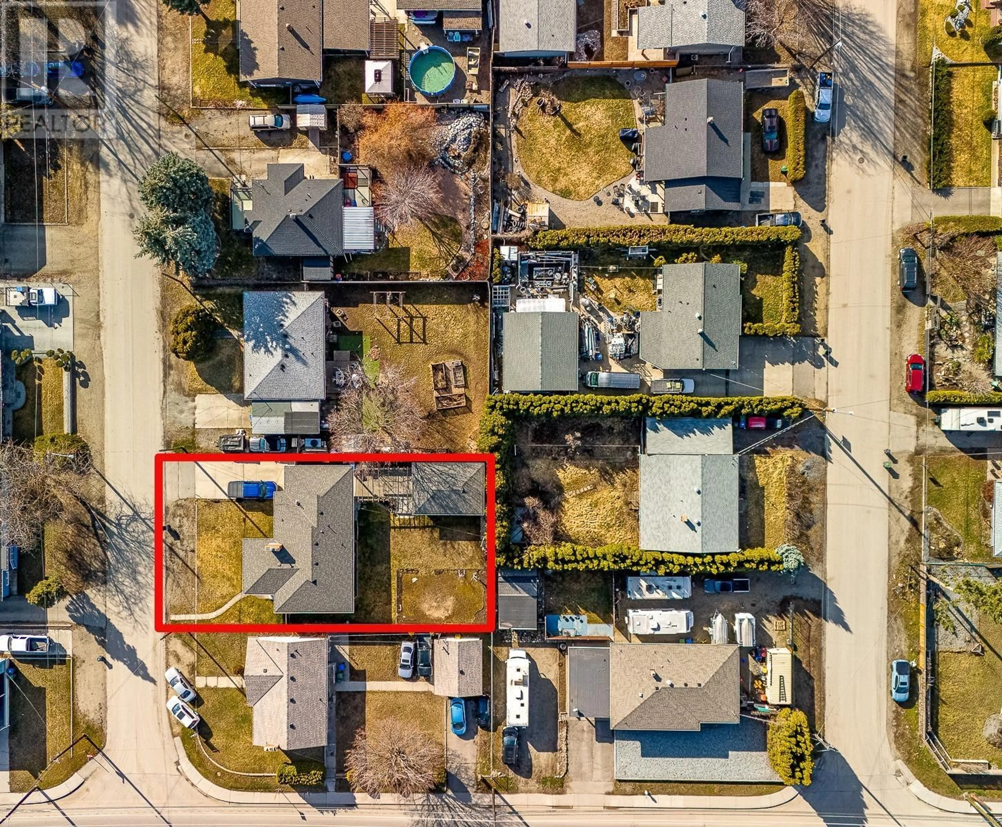 A pic from outside/outdoor area/front of a property/back of a property/a pic from drone, street for 520 DONHAUSER ROAD, Kelowna British Columbia V1X3G1