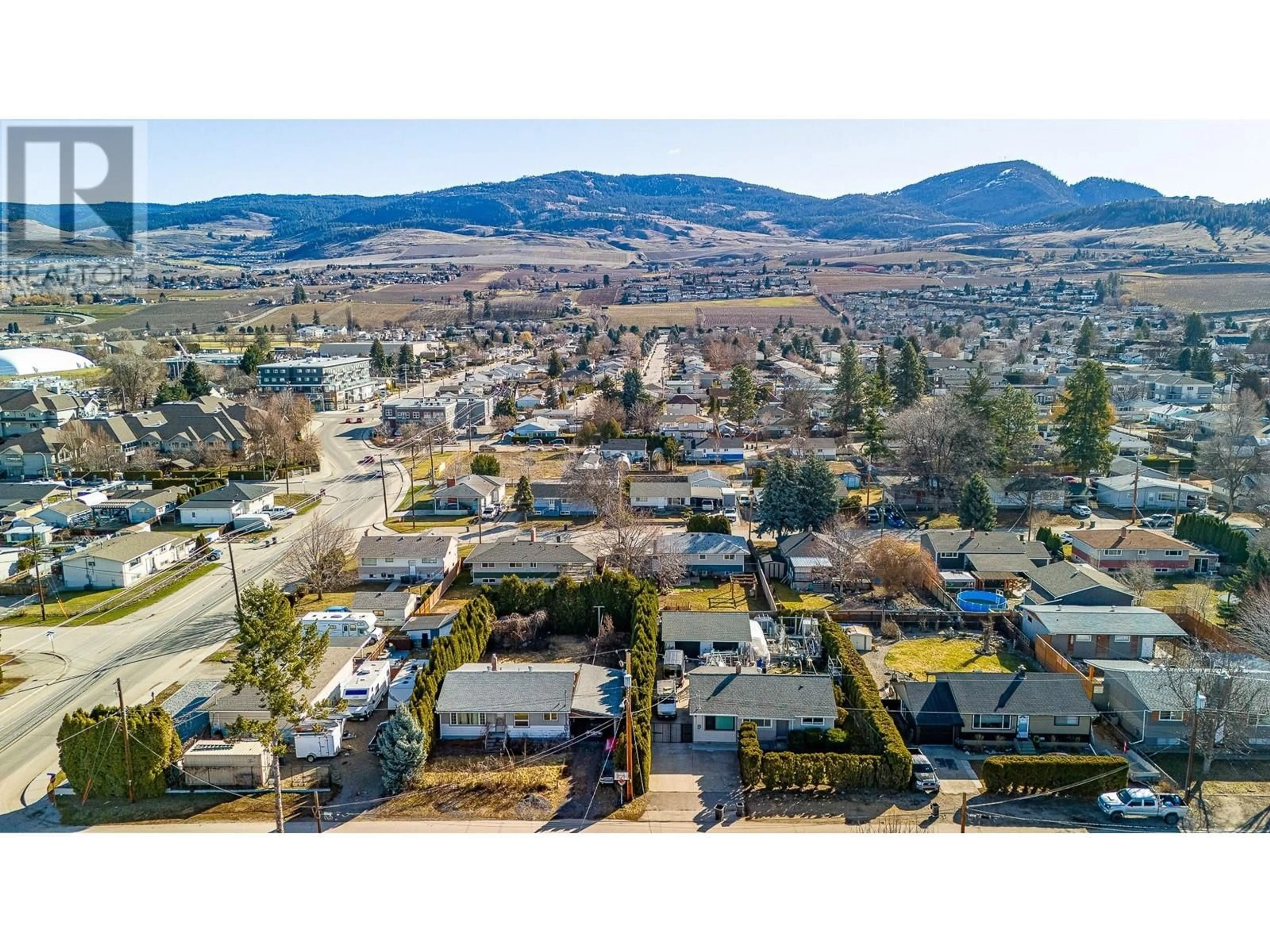 A pic from outside/outdoor area/front of a property/back of a property/a pic from drone, mountain view for 520 DONHAUSER ROAD, Kelowna British Columbia V1X3G1