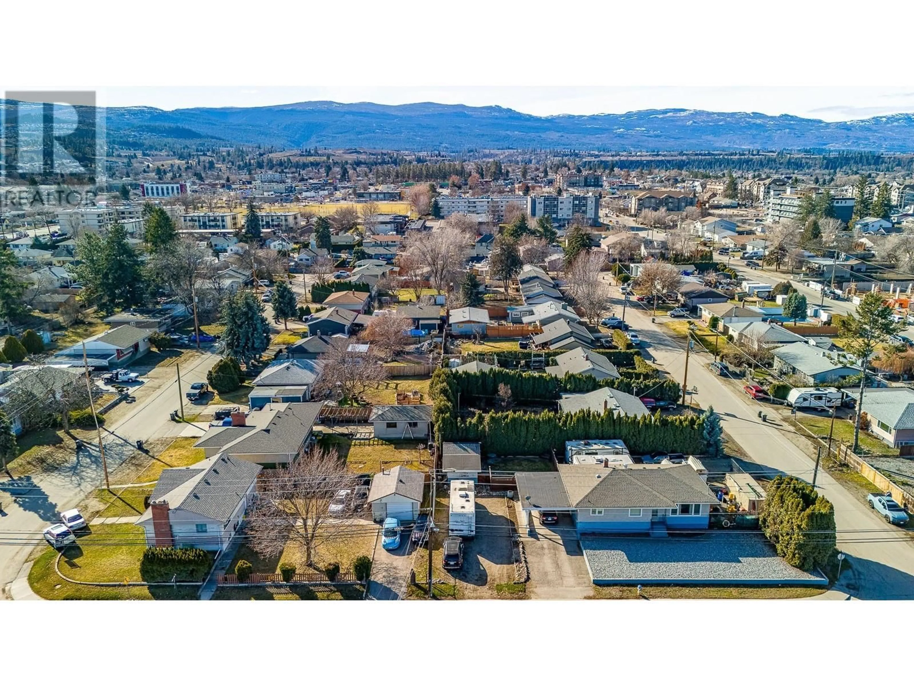 A pic from outside/outdoor area/front of a property/back of a property/a pic from drone, mountain view for 520 DONHAUSER ROAD, Kelowna British Columbia V1X3G1