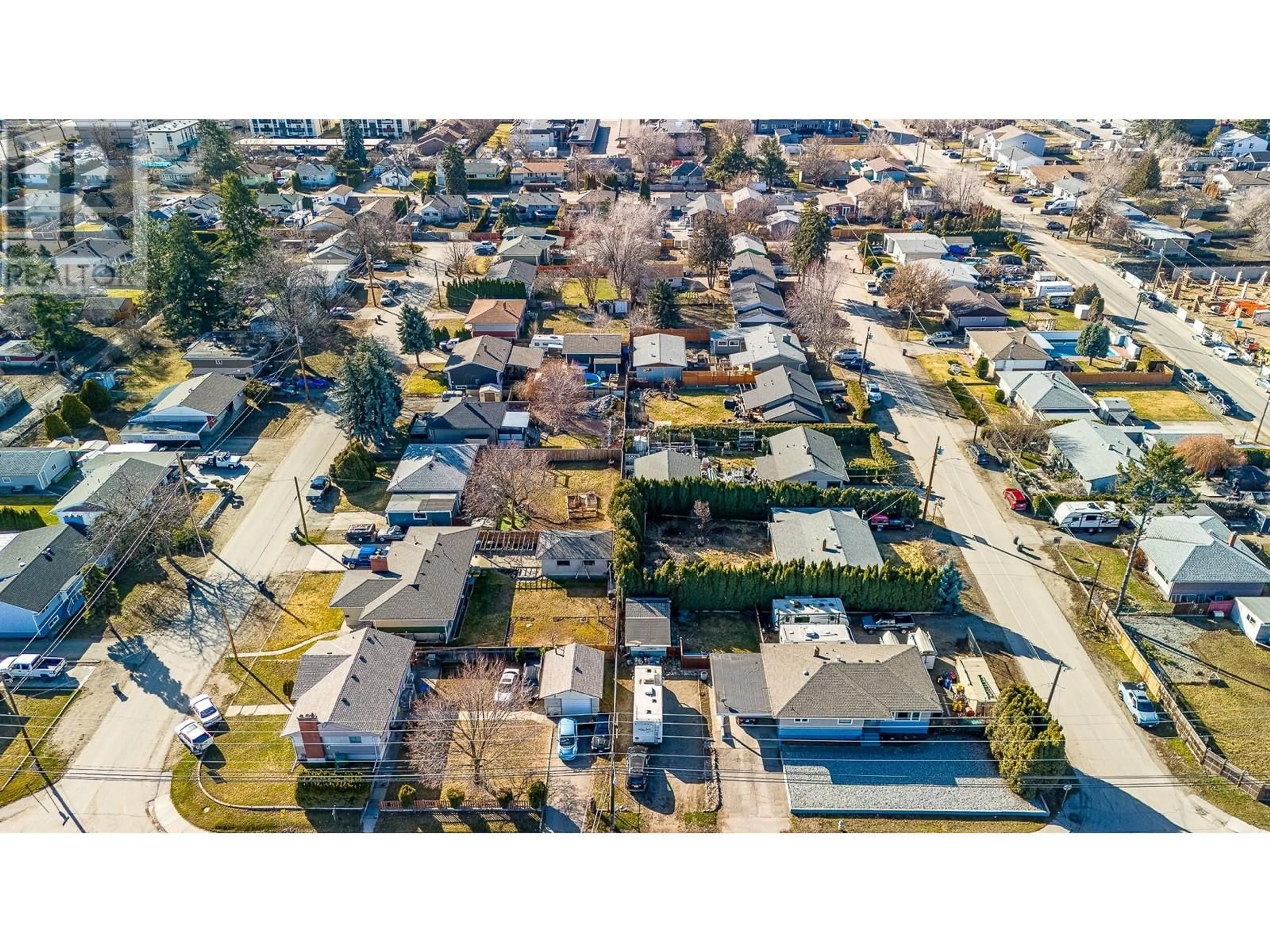 A pic from outside/outdoor area/front of a property/back of a property/a pic from drone, street for 520 DONHAUSER ROAD, Kelowna British Columbia V1X3G1