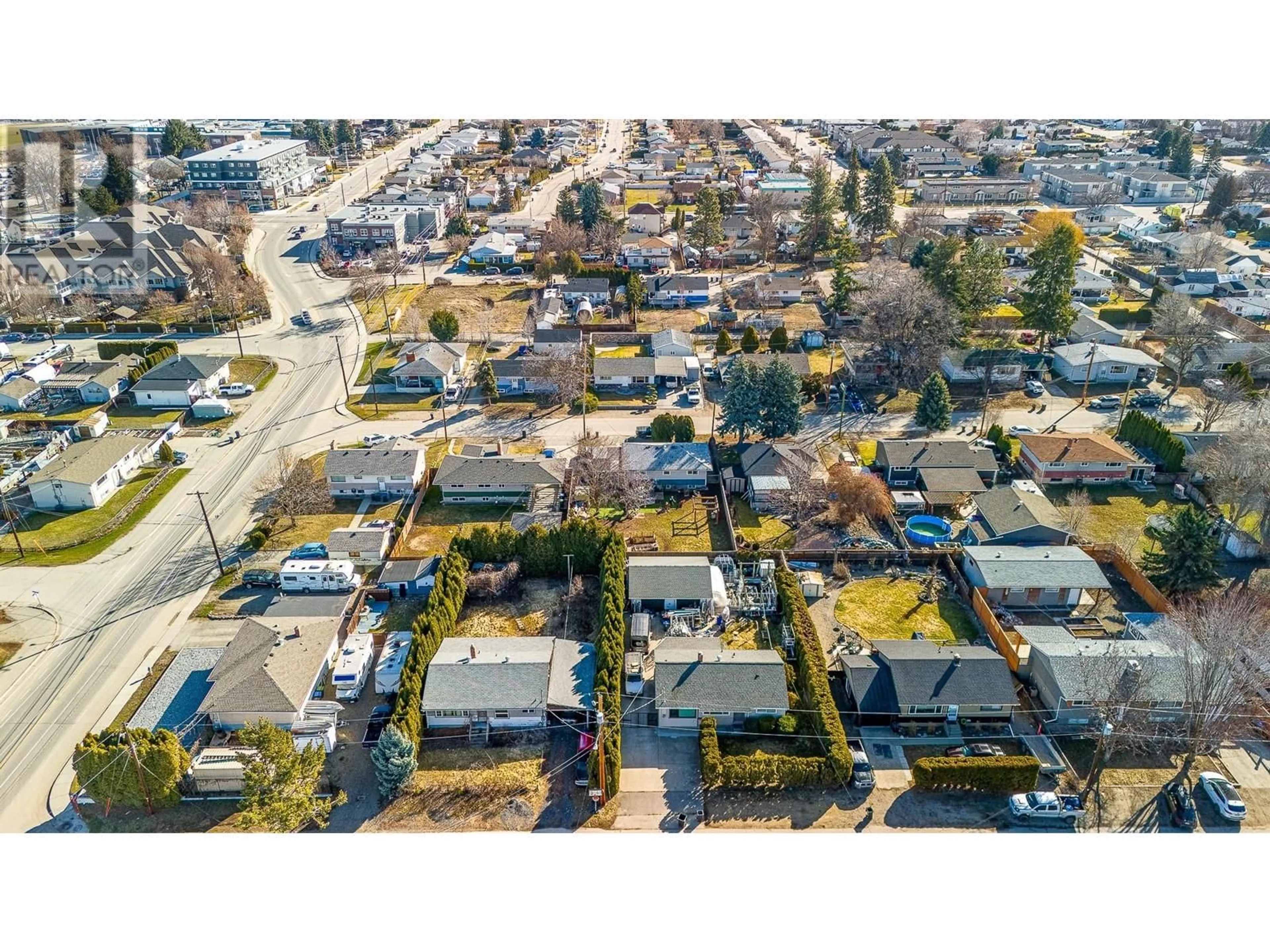 A pic from outside/outdoor area/front of a property/back of a property/a pic from drone, street for 520 DONHAUSER ROAD, Kelowna British Columbia V1X3G1