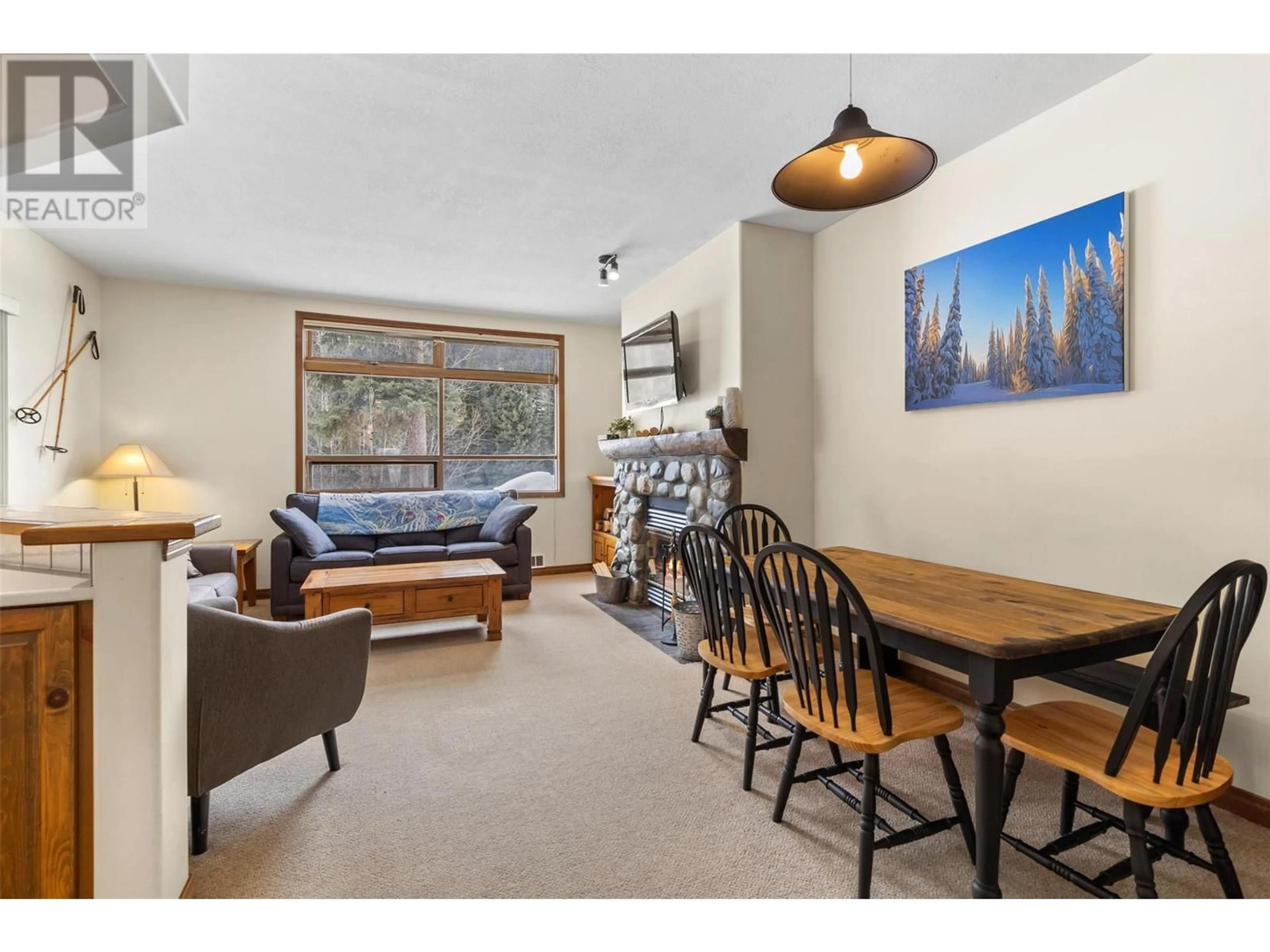 Living room with furniture, wood/laminate floor for 15 - 2140 SUN PEAKS ROAD, Sun Peaks British Columbia V0E5N0