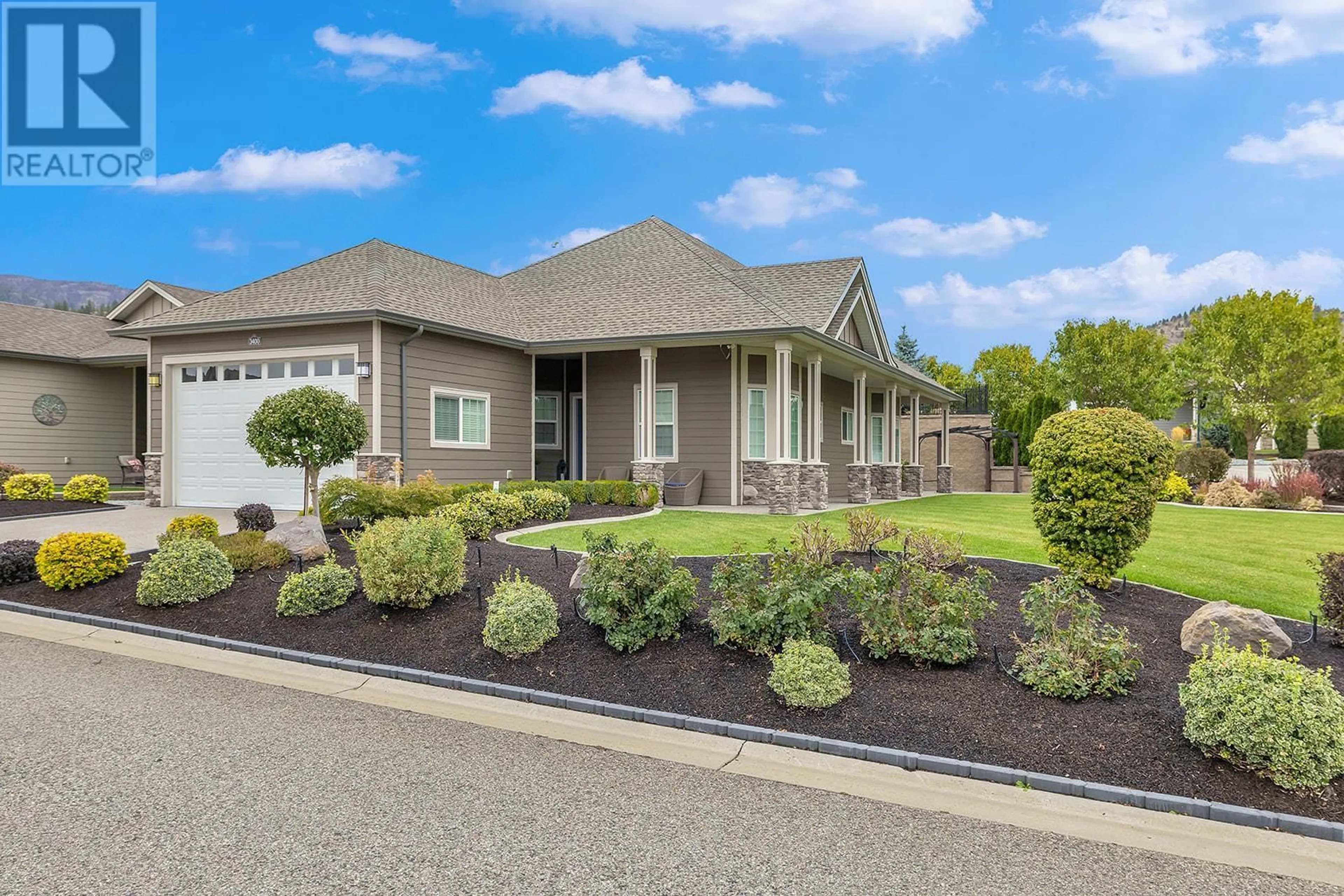 Home with vinyl exterior material, street for 3400 KINGFISHER ROAD, West Kelowna British Columbia V4T3A5