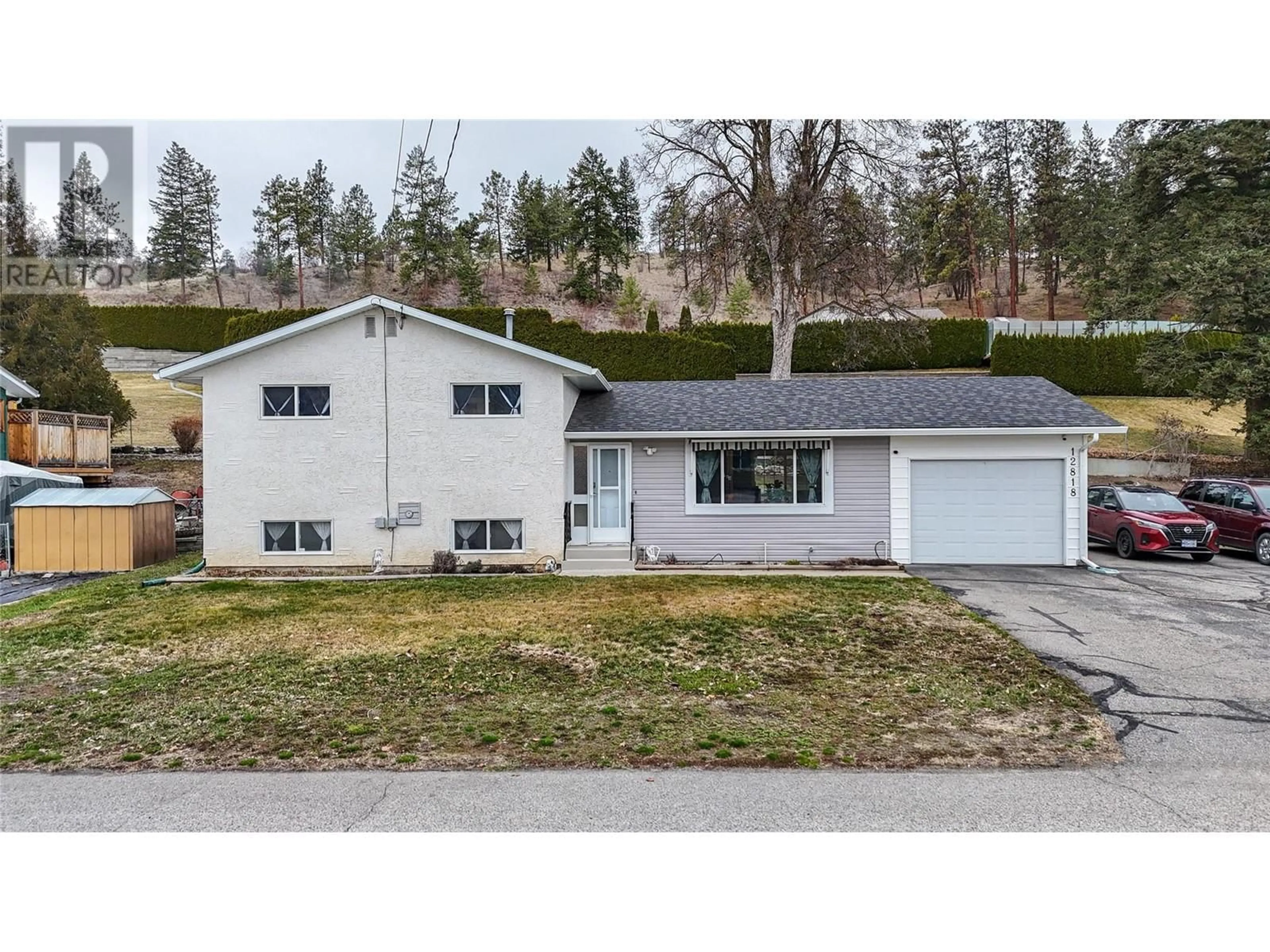 Home with vinyl exterior material, street for 12818 REYNOLDS AVENUE, Summerland British Columbia V0H1Z8