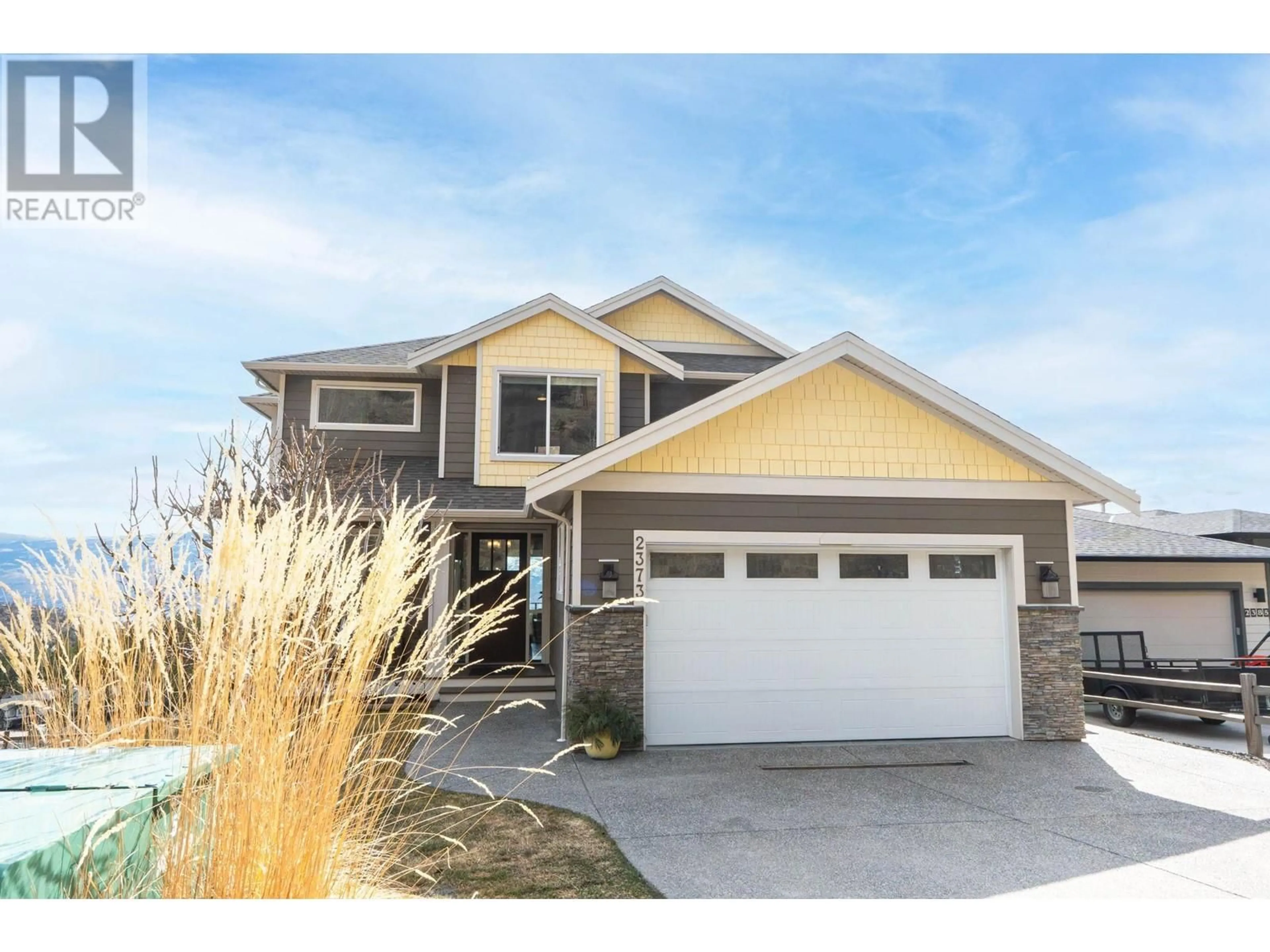 Home with vinyl exterior material, street for 2373 BIG SKY DRIVE, West Kelowna British Columbia V4T3K4