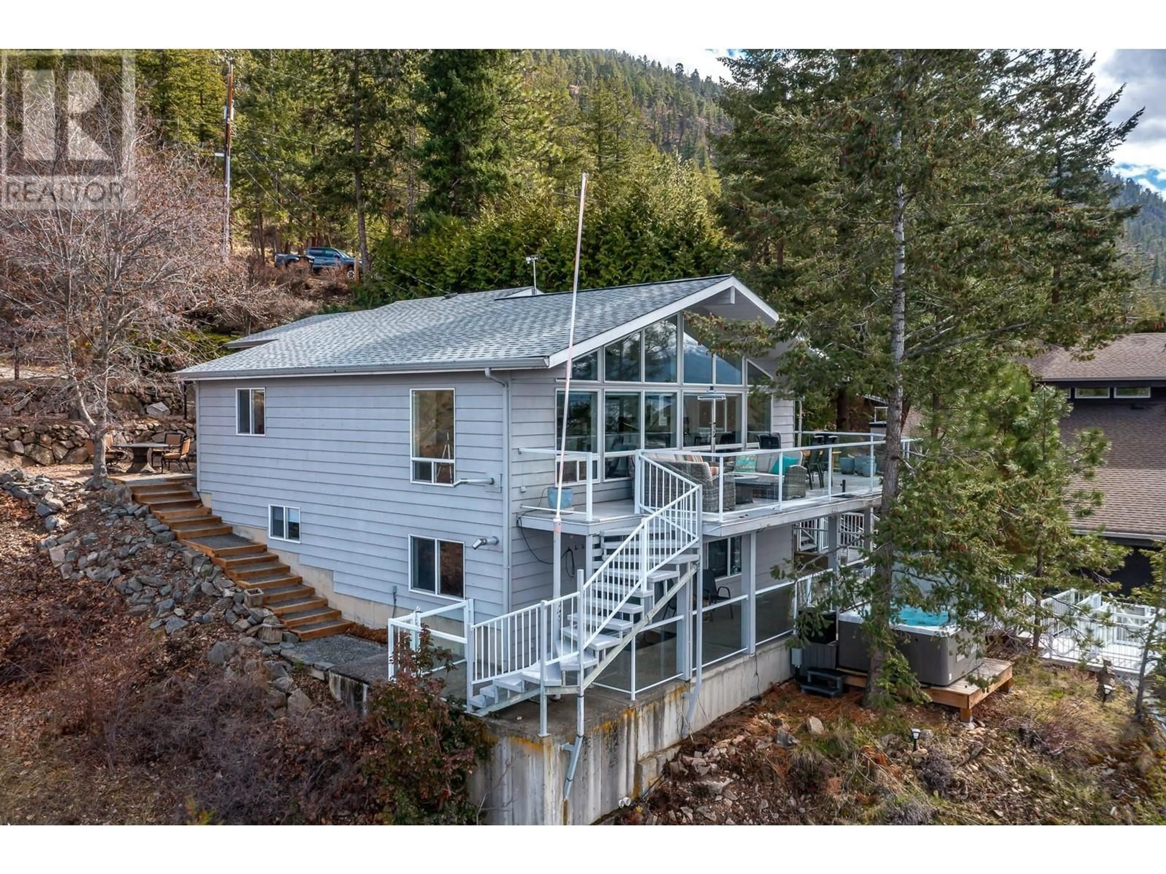 A pic from outside/outdoor area/front of a property/back of a property/a pic from drone, water/lake/river/ocean view for 2 - 9900 EASTSIDE ROAD, Vernon British Columbia V1H1L6