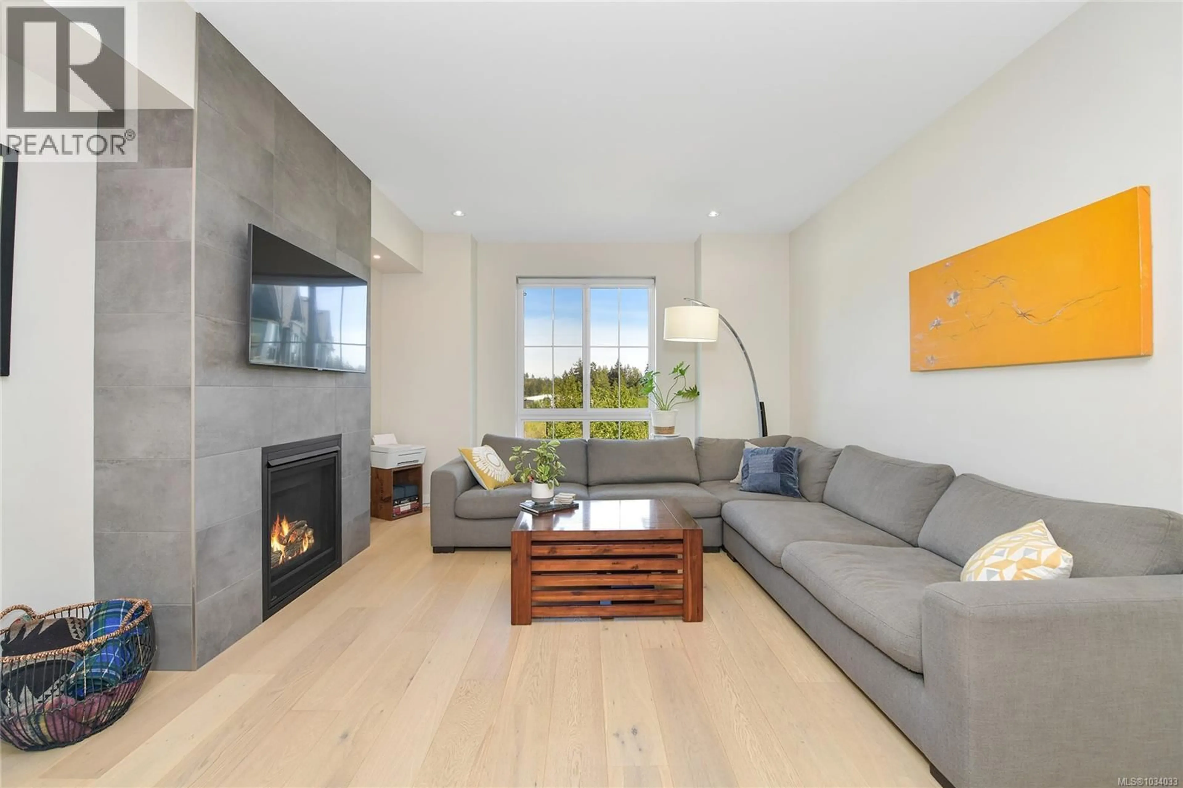 Living room with furniture, wood/laminate floor for 103 - 3284 KETTLE CREEK CRESCENT, Langford British Columbia V9B0Y4