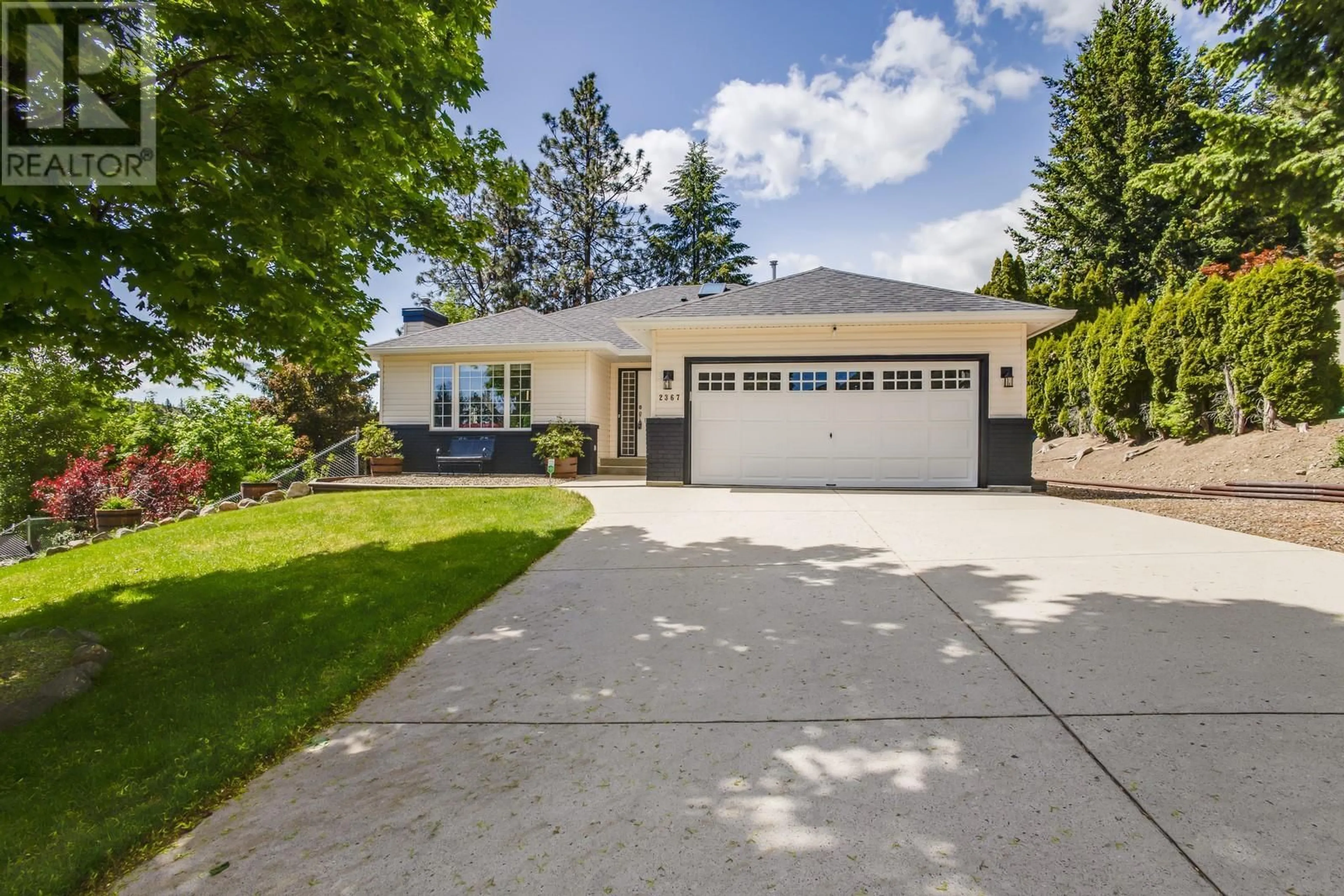 Home with vinyl exterior material, street for 2367 SHANNON WOODS DRIVE, West Kelowna British Columbia V4T2L9