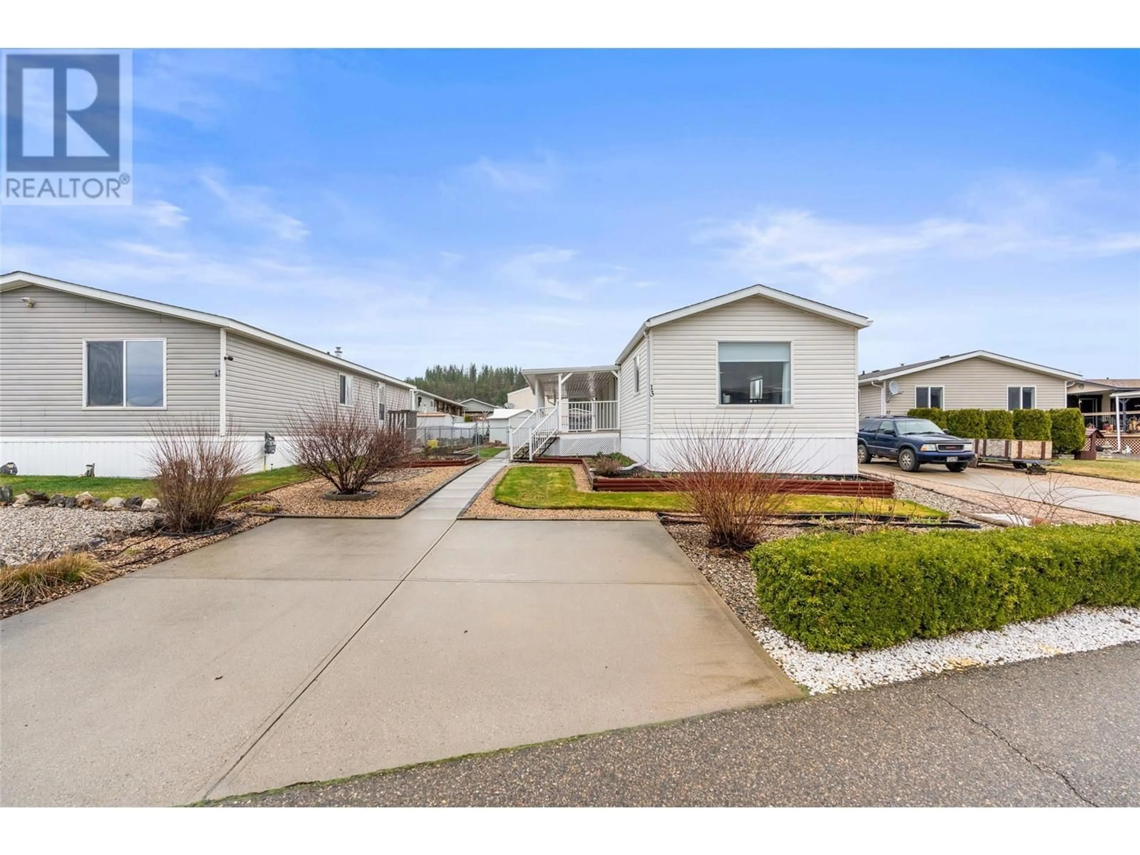 Home with vinyl exterior material, street for 13 - 12560 WESTSIDE ROAD, Vernon British Columbia V1H1S9