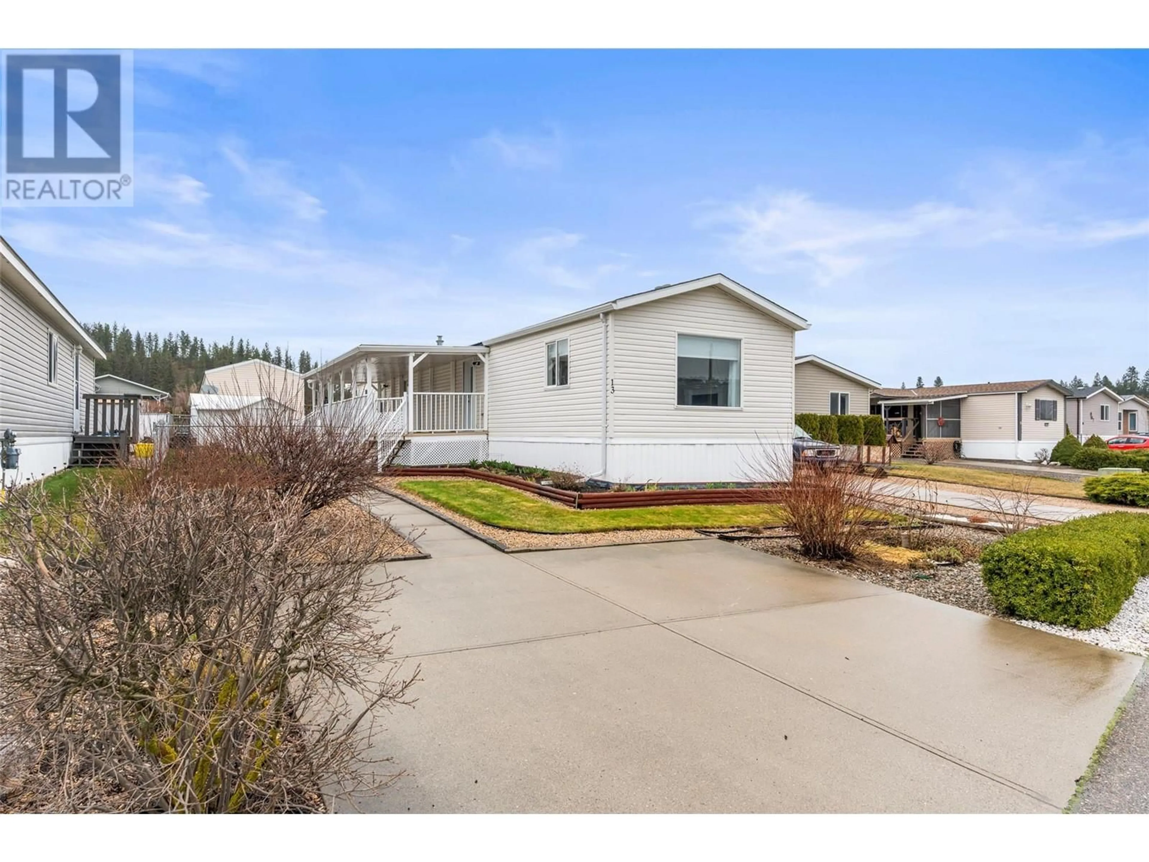 Home with vinyl exterior material, street for 13 - 12560 WESTSIDE ROAD, Vernon British Columbia V1H1S9