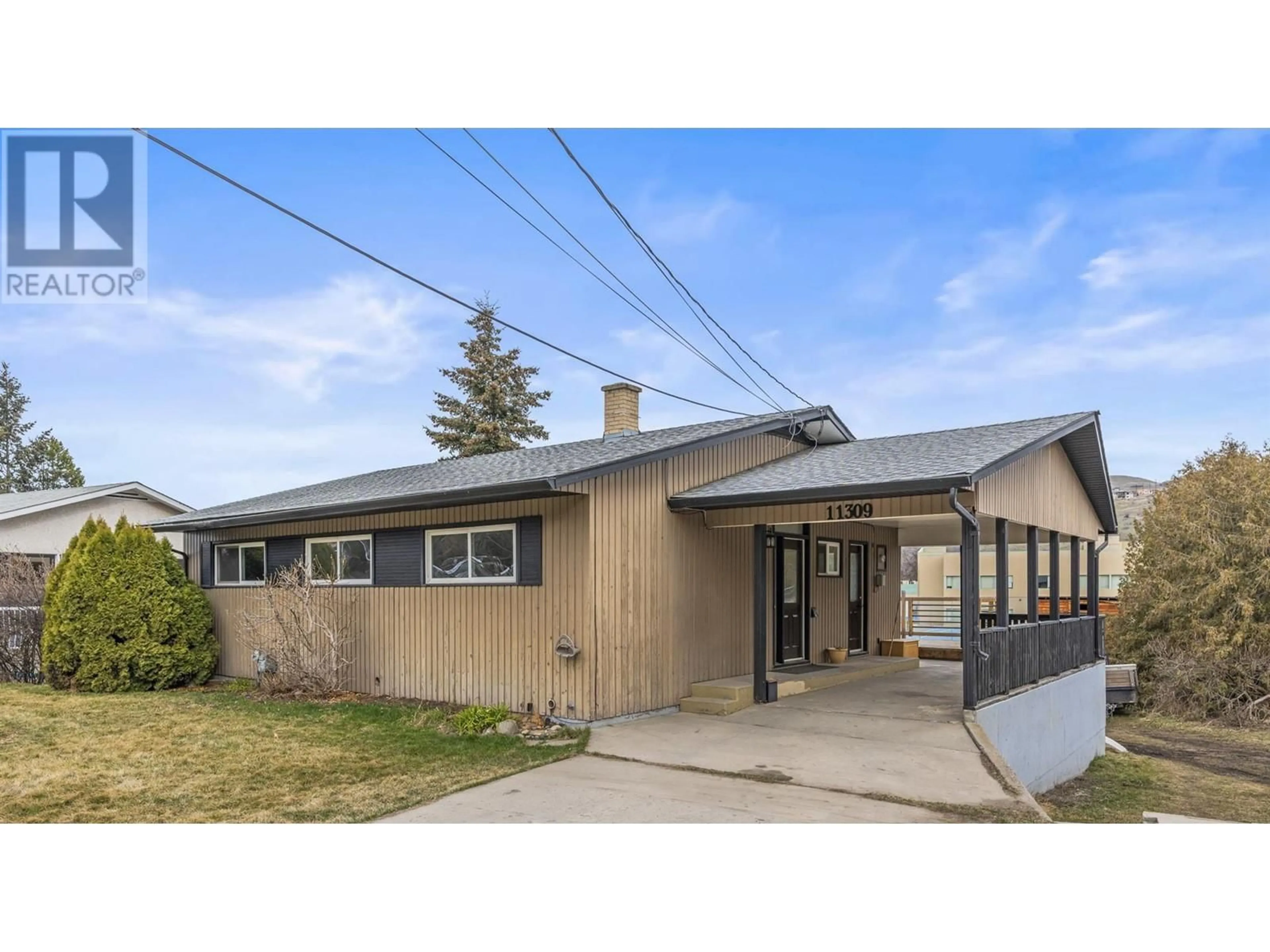 Home with vinyl exterior material, street for 11309 TASSIE DRIVE, Coldstream British Columbia V1B1H3