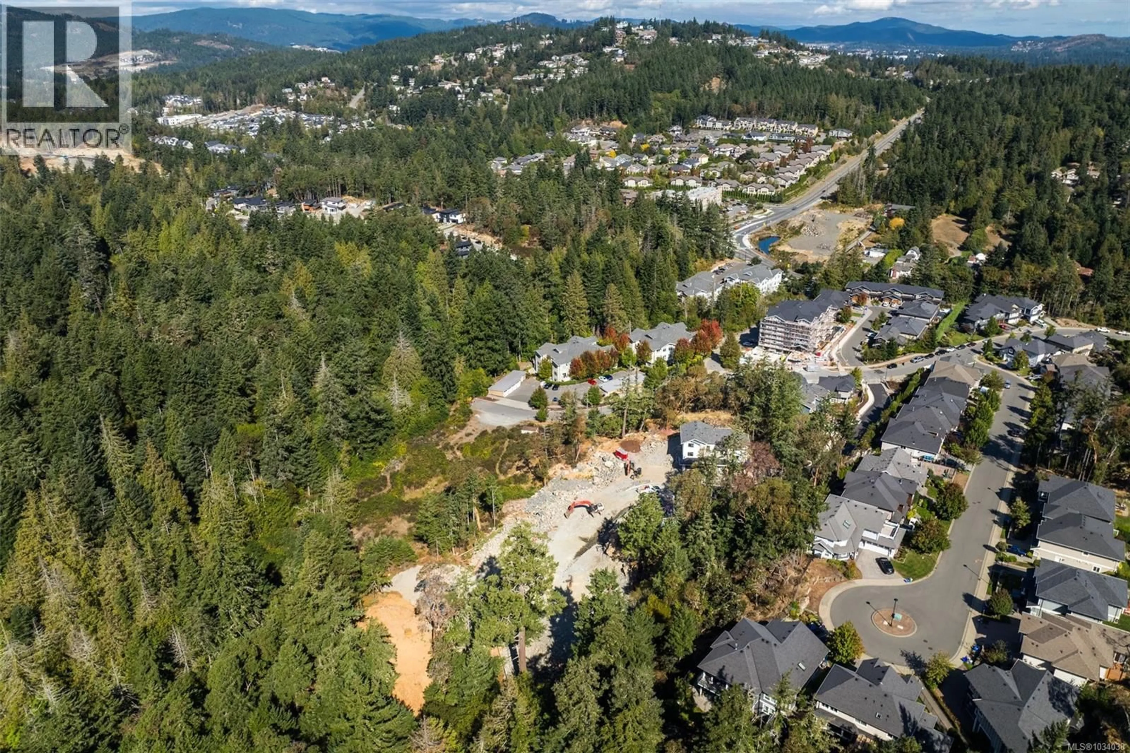 A pic from outside/outdoor area/front of a property/back of a property/a pic from drone, mountain view for 2 - 571 BEZANTON WAY, Colwood British Columbia V9C0H2