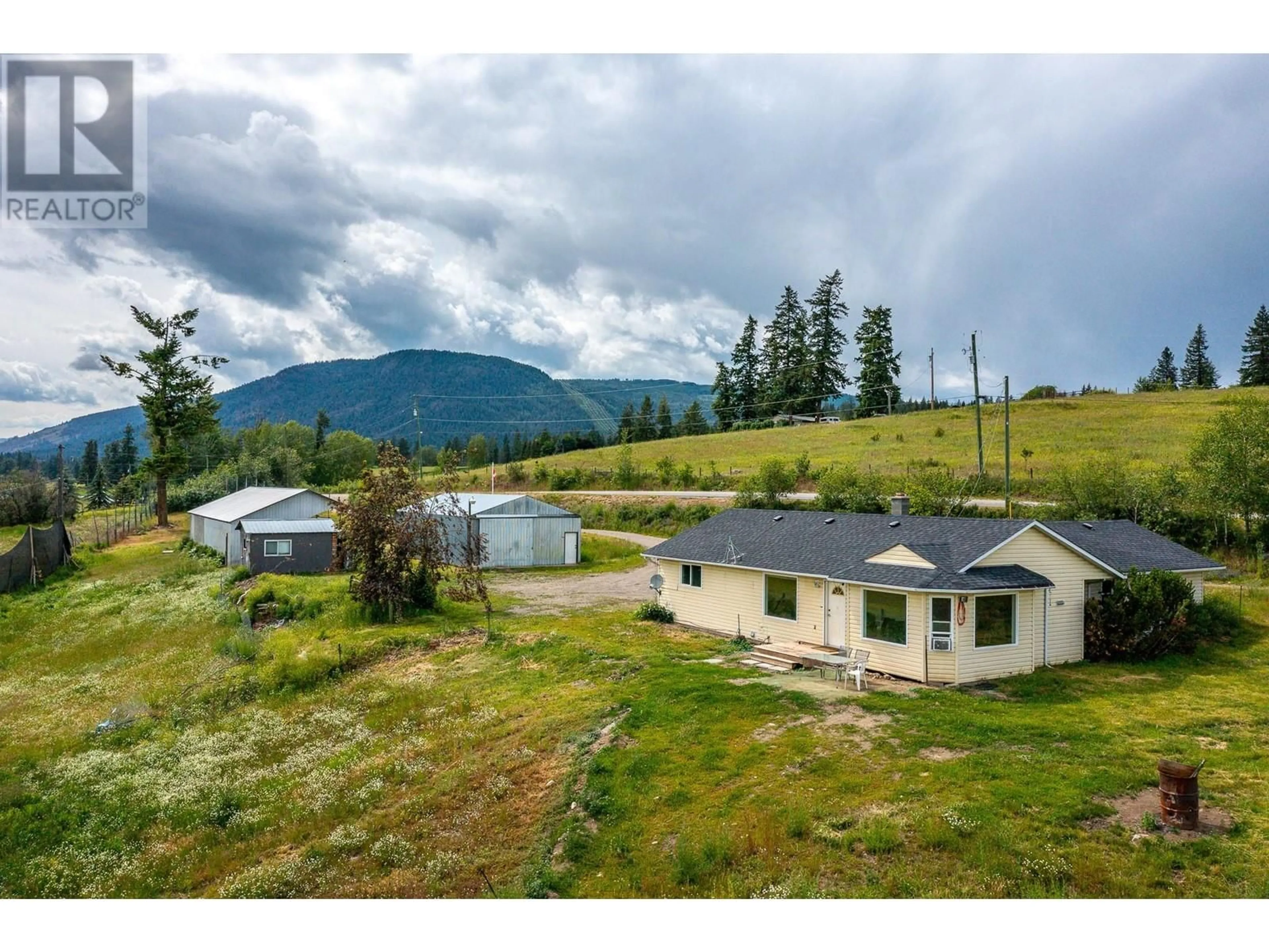 A pic from outside/outdoor area/front of a property/back of a property/a pic from drone, mountain view for 3575 CANYON ROAD, Spallumcheen British Columbia V0E1B4