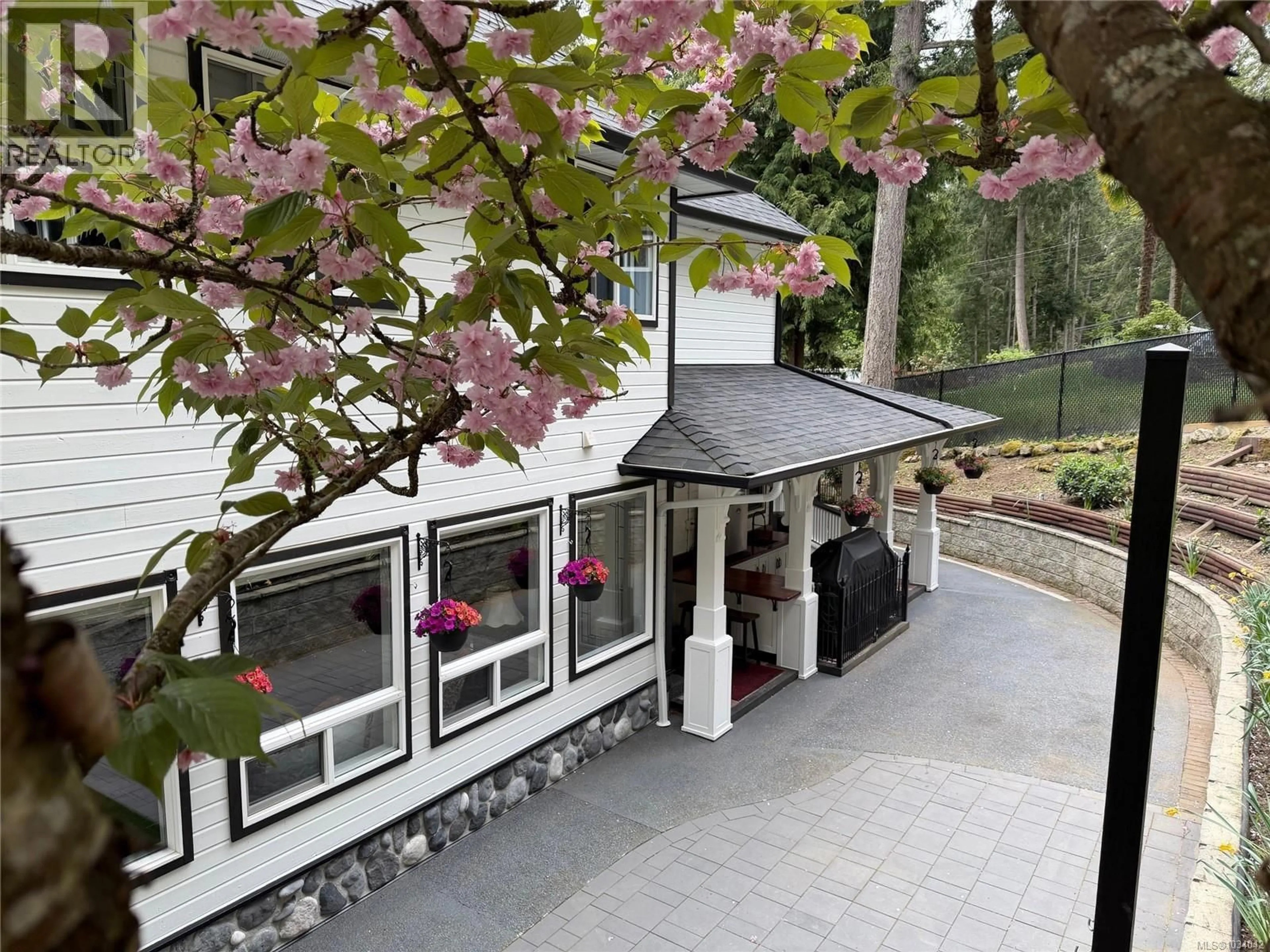 A pic from outside/outdoor area/front of a property/back of a property/a pic from drone, unknown for 7072 WILLIS POINT ROAD, Central Saanich British Columbia V9E2A1