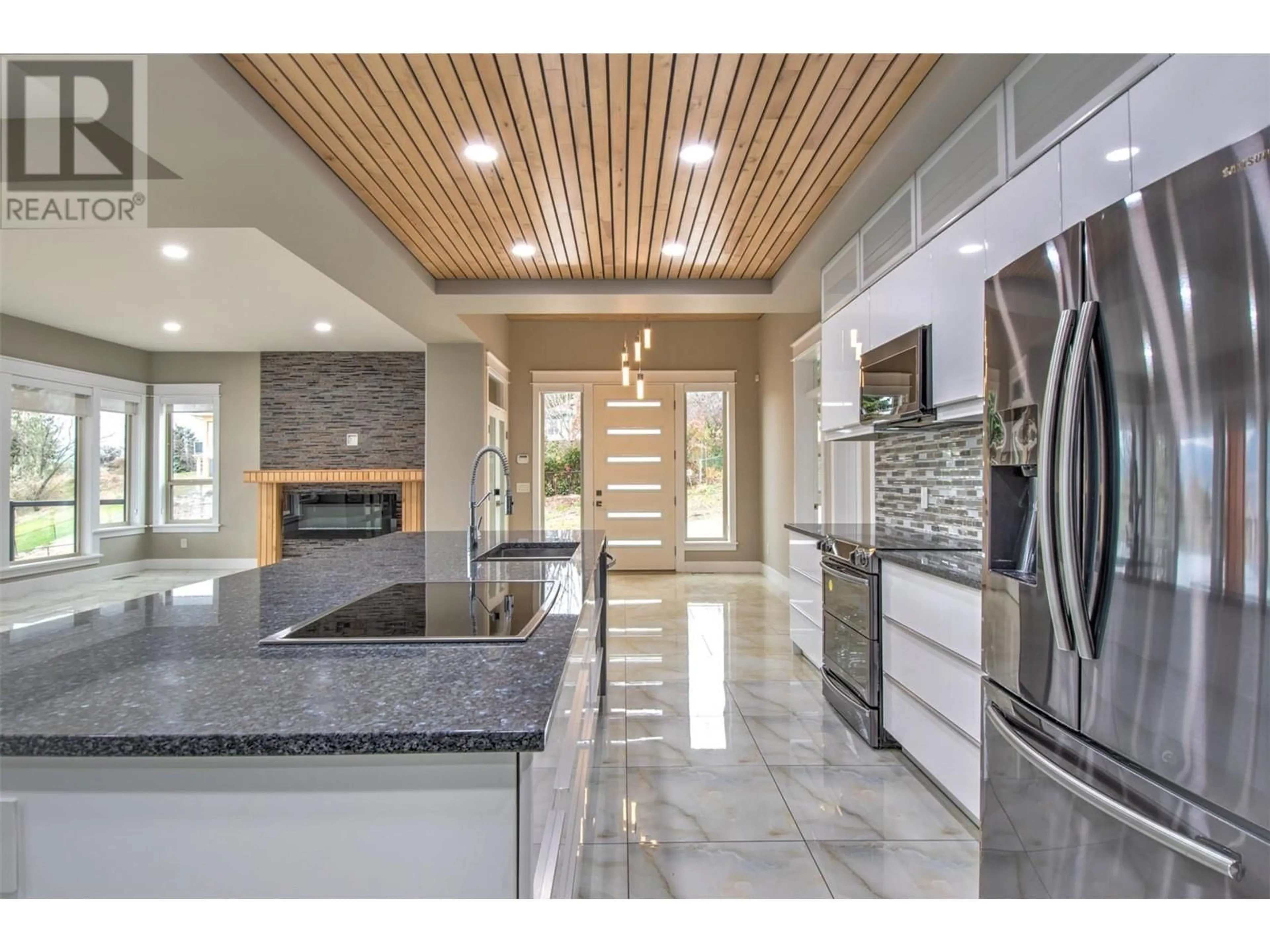 Open concept kitchen, ceramic/tile floor for 7509 KENNEDY LANE, Vernon British Columbia V1H1C4