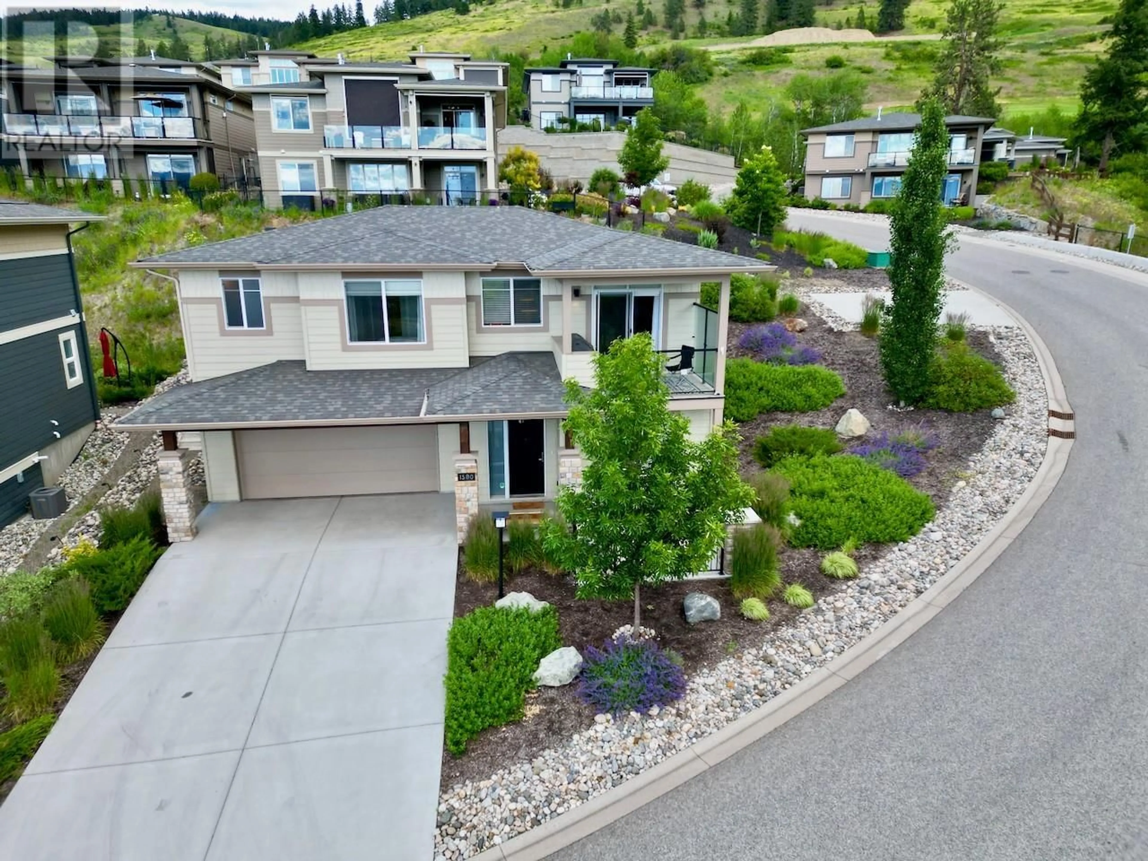 A pic from outside/outdoor area/front of a property/back of a property/a pic from drone, mountain view for 1580 TOWER RANCH DRIVE, Kelowna British Columbia V1P1T8