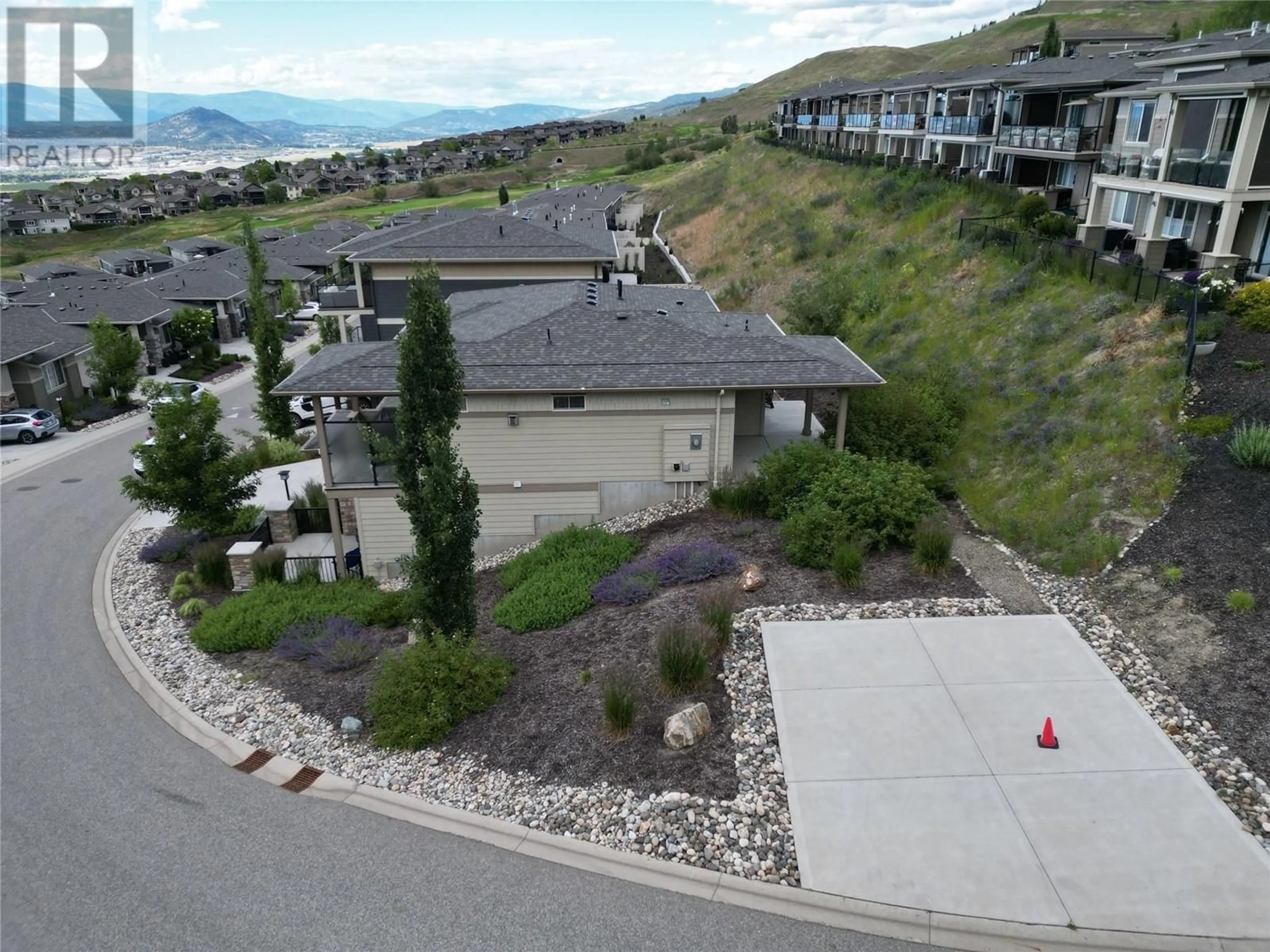 A pic from outside/outdoor area/front of a property/back of a property/a pic from drone, mountain view for 1580 TOWER RANCH DRIVE, Kelowna British Columbia V1P1T8