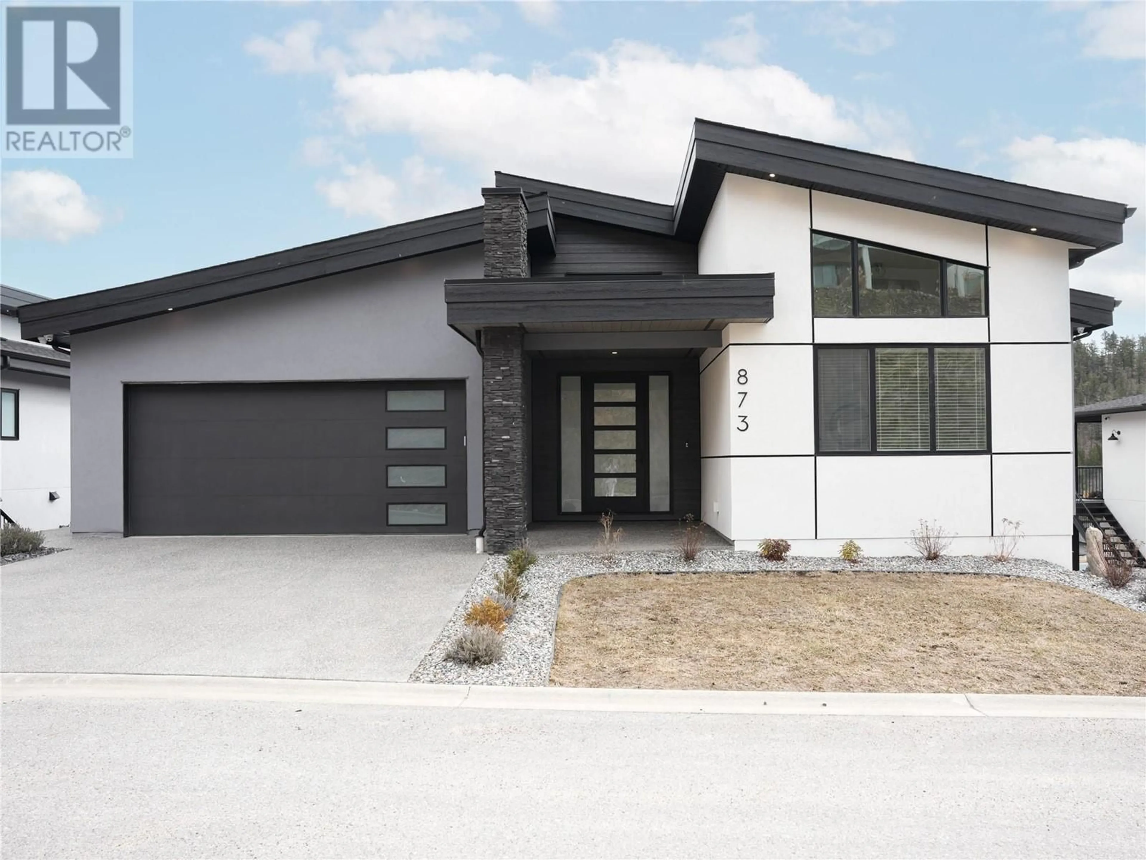 Home with brick exterior material, street for 873 ROYAL TROON LANE, Kelowna British Columbia V1P0A3