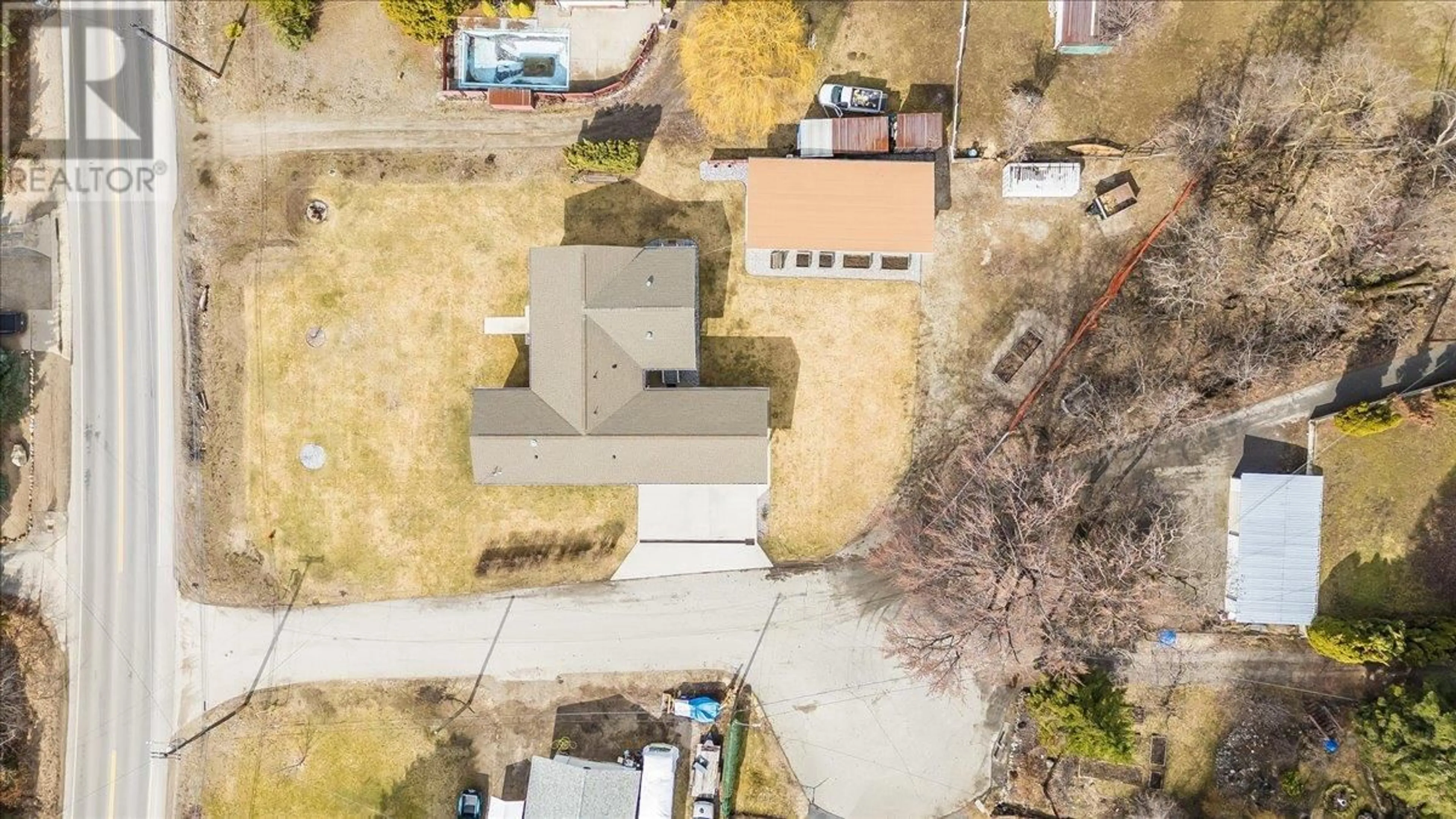 A pic from outside/outdoor area/front of a property/back of a property/a pic from drone, street for 8480 HIGHWAY 22A OTHER, Trail British Columbia V1R4W8