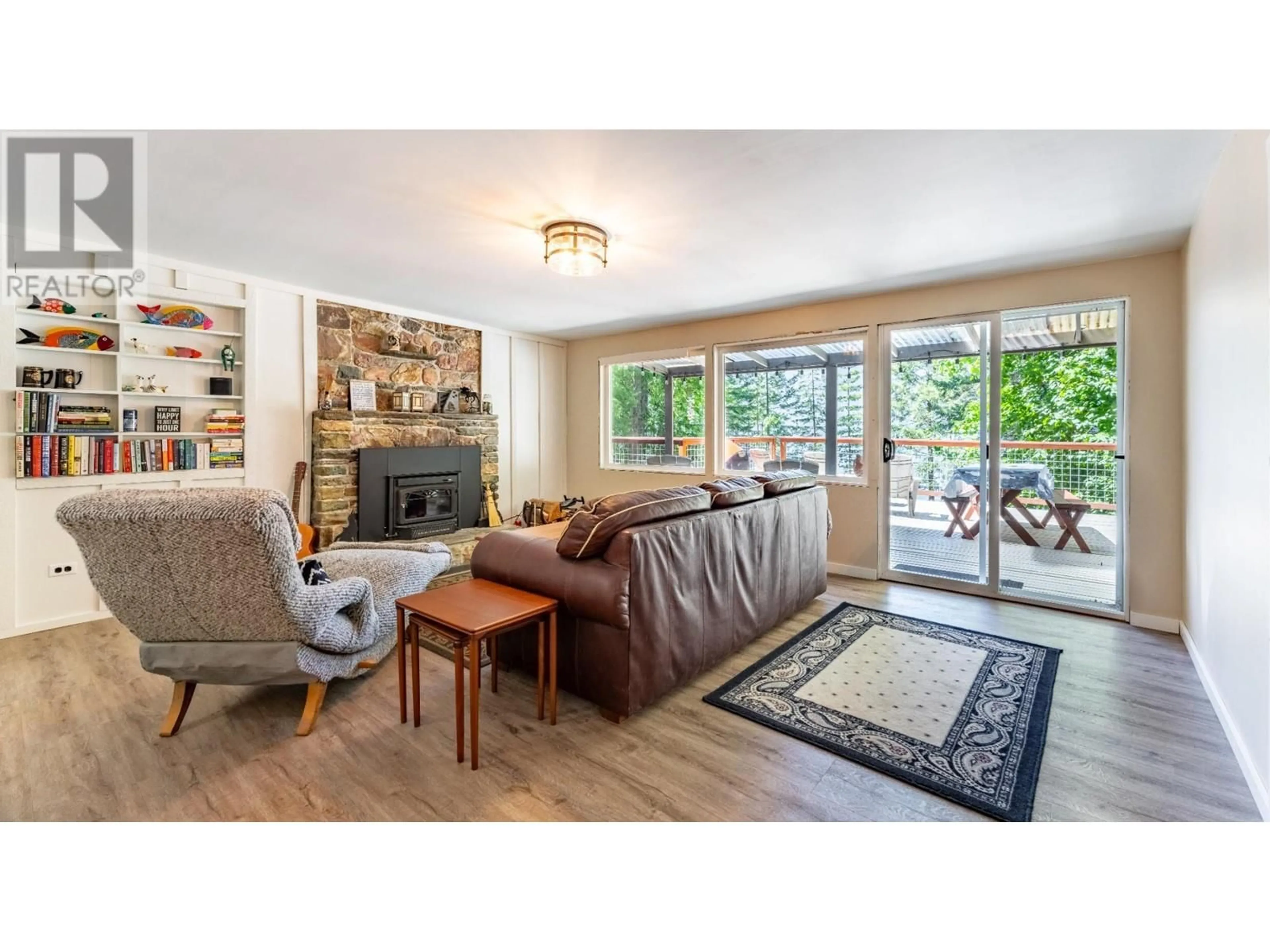 Living room with furniture, wood/laminate floor for 13507 3A HIGHWAY, Boswell British Columbia V0B1A0