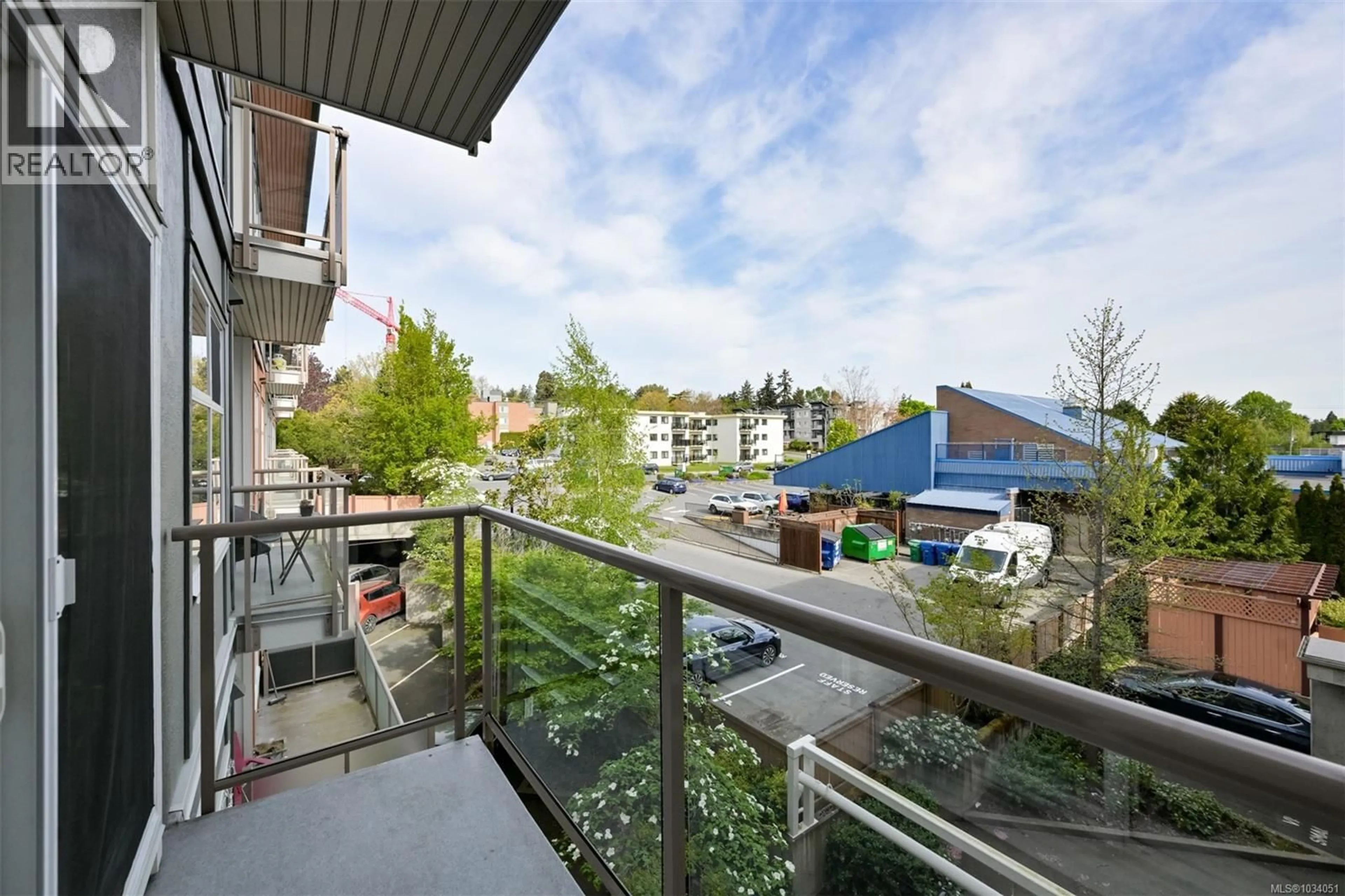 Balcony in the apartment, city buildings view from balcony for 311 - 1550 CHURCH AVENUE, Saanich British Columbia V8P2H1