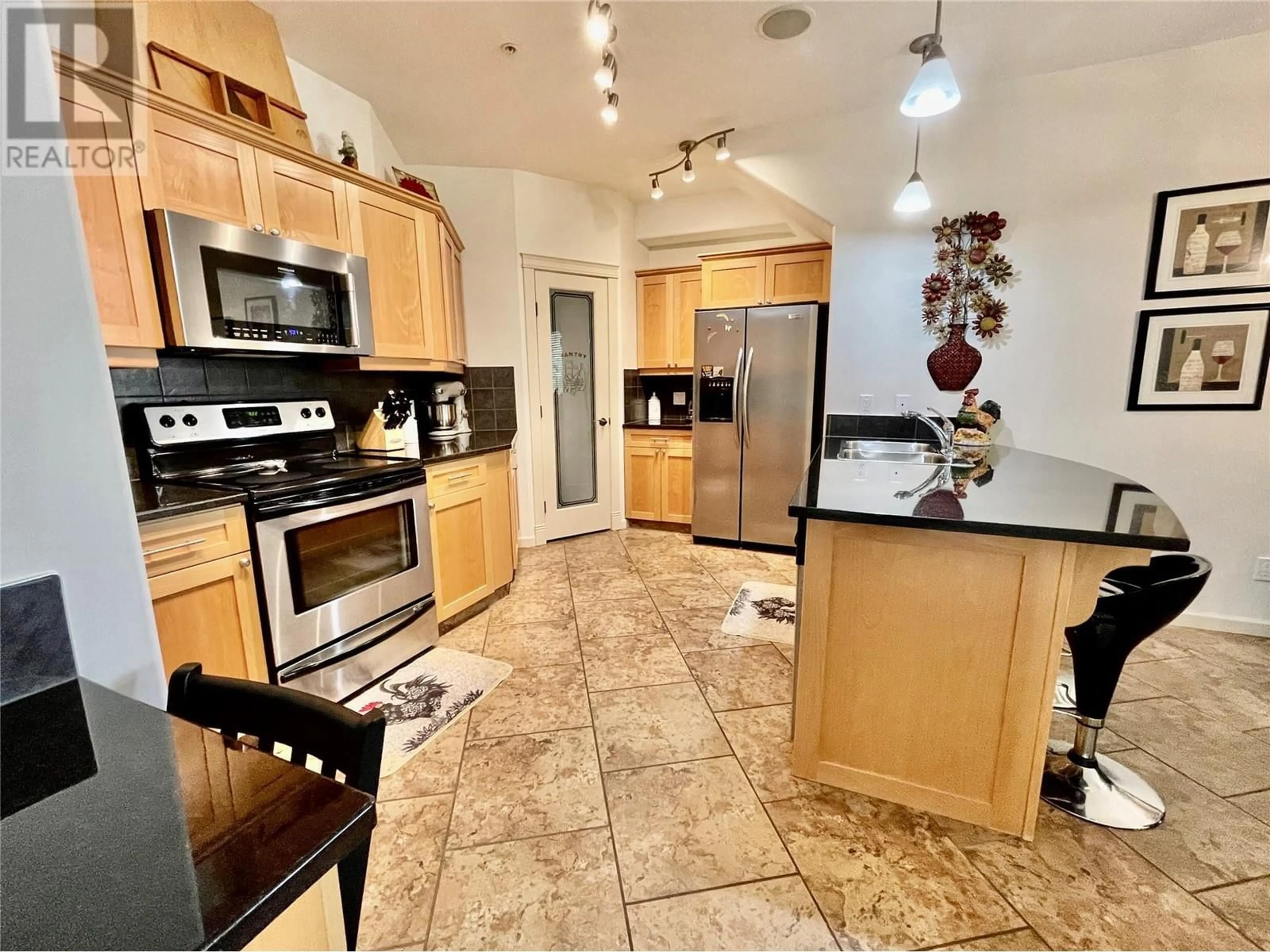 Open concept kitchen, ceramic/tile floor for 8 - 1130 RIVERSIDE AVENUE, Sicamous British Columbia V0E2V1