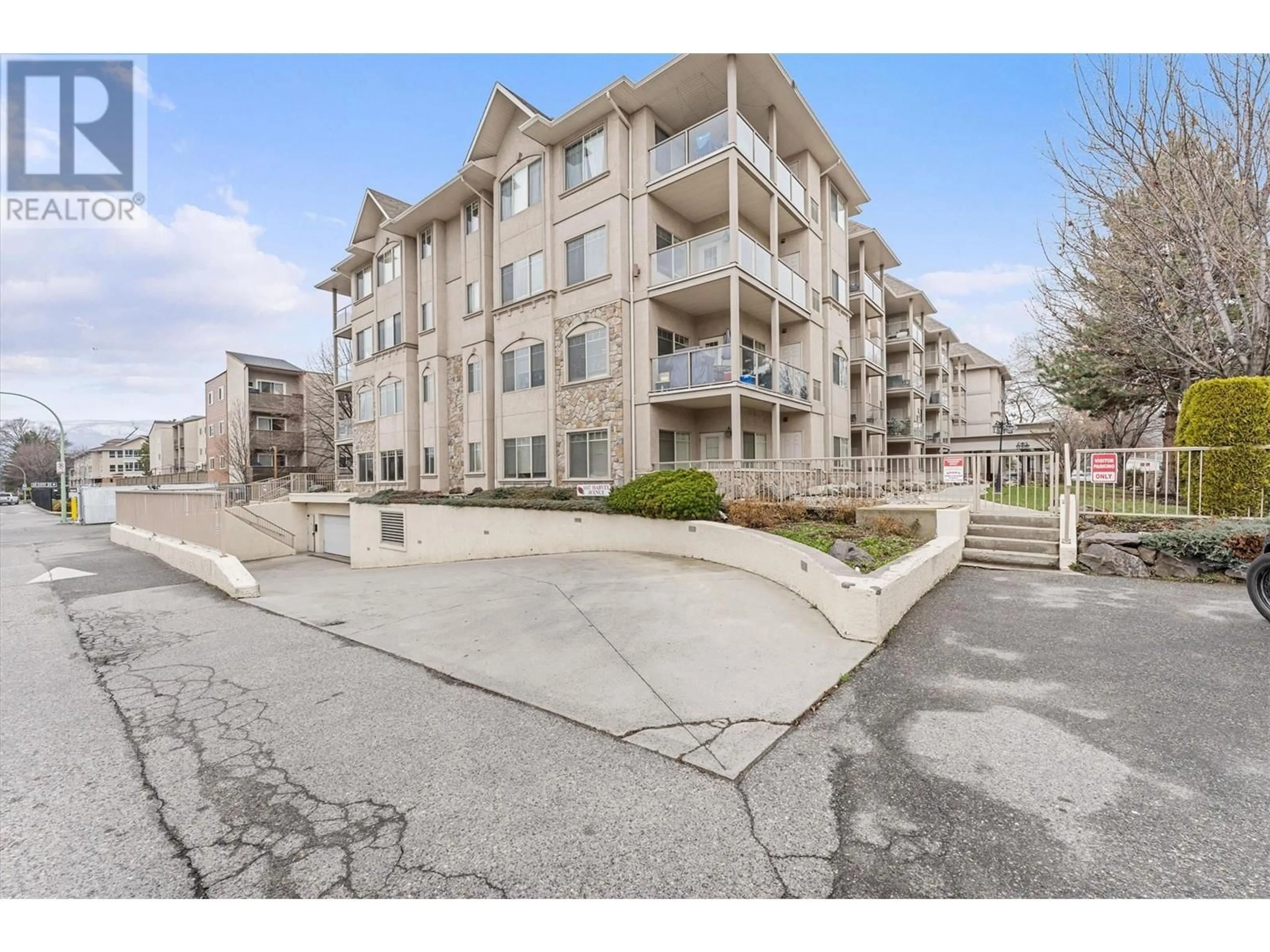 A pic from outside/outdoor area/front of a property/back of a property/a pic from drone, unknown for 206 - 1007 HARVEY AVENUE, Kelowna British Columbia V1Y6E4