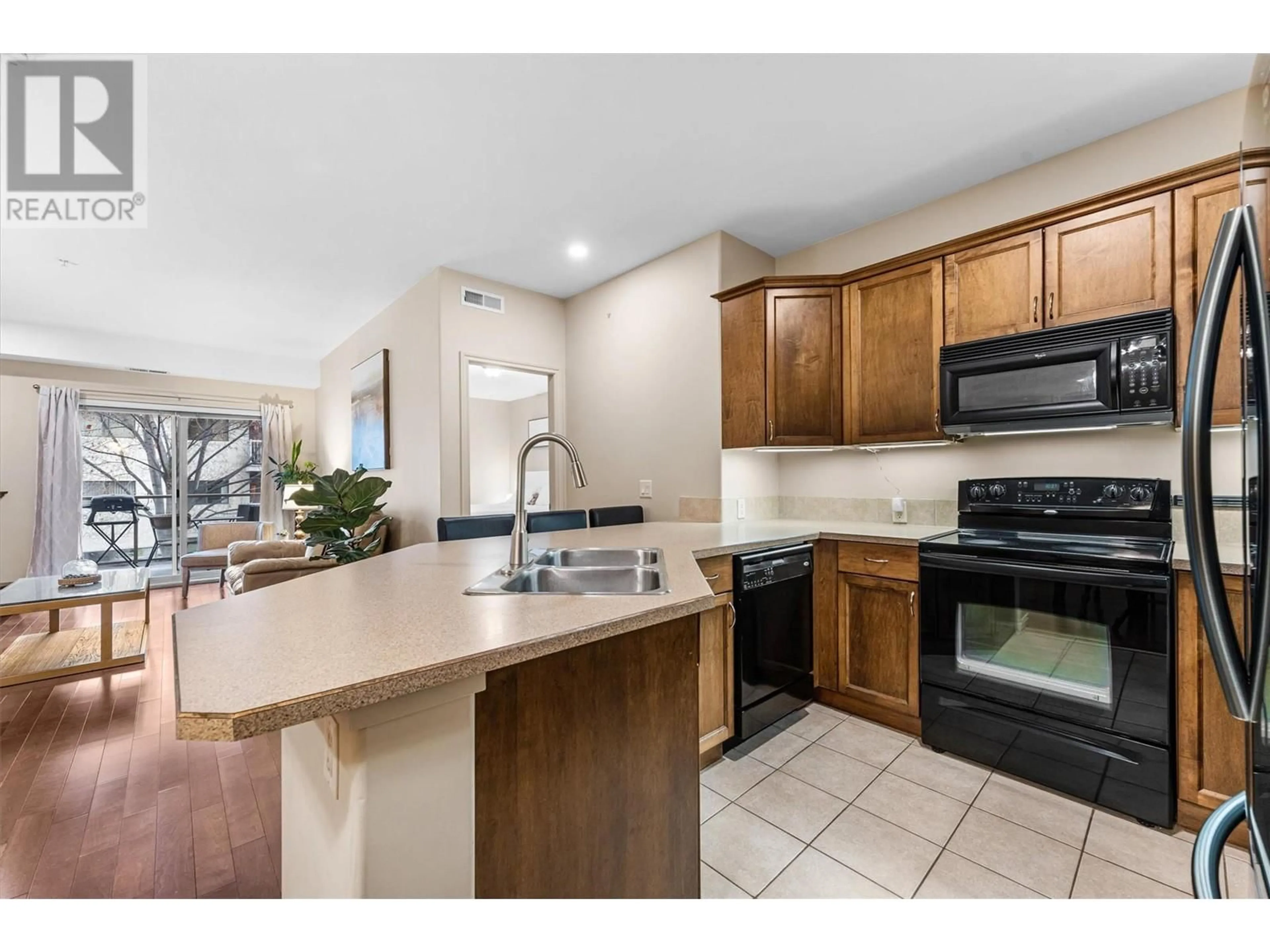 Open concept kitchen, ceramic/tile floor for 206 - 1007 HARVEY AVENUE, Kelowna British Columbia V1Y6E4