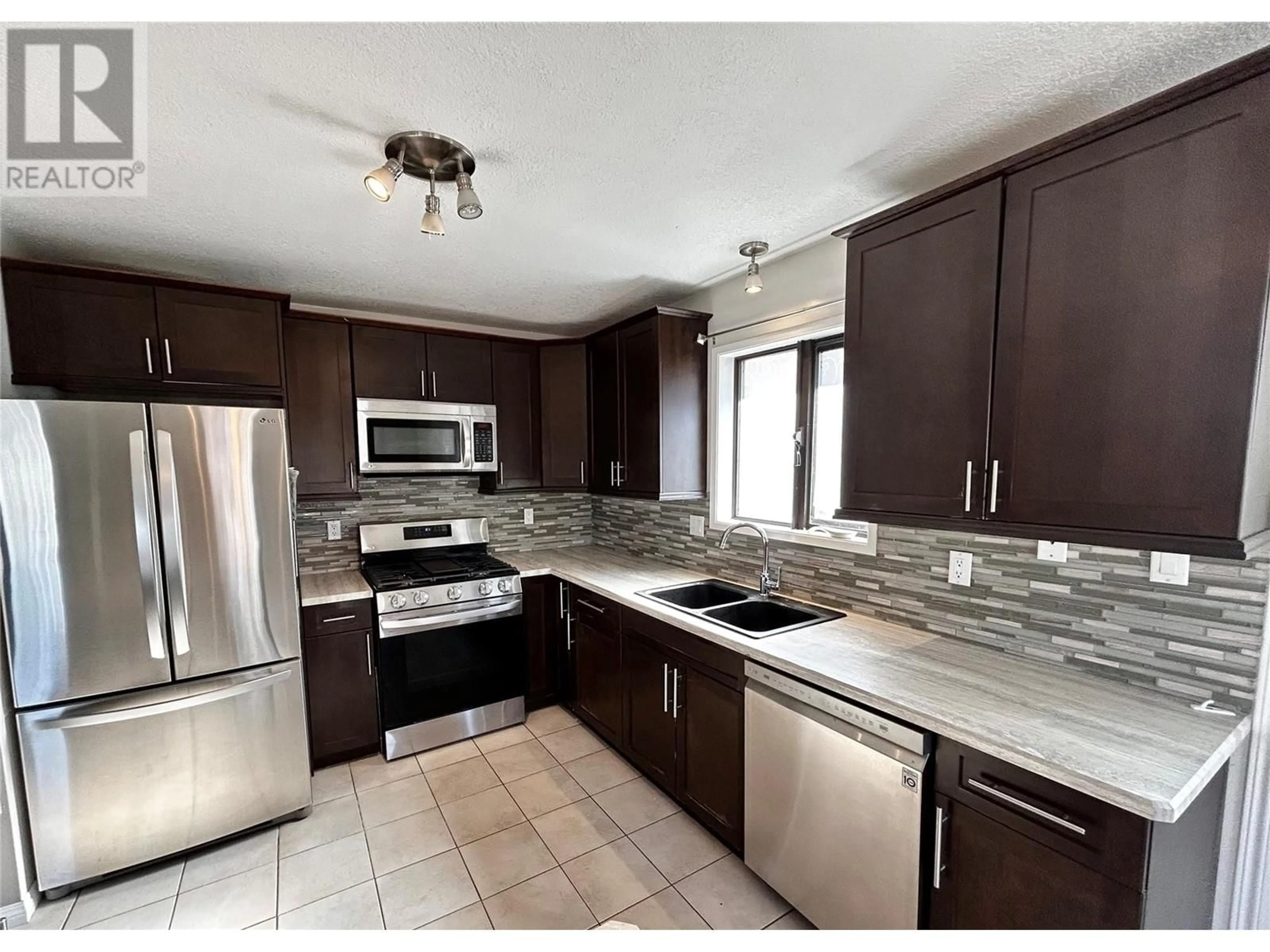 Open concept kitchen, ceramic/tile floor for 256 PEACE RIVER CRESCENT, Tumbler Ridge British Columbia V0C2W0