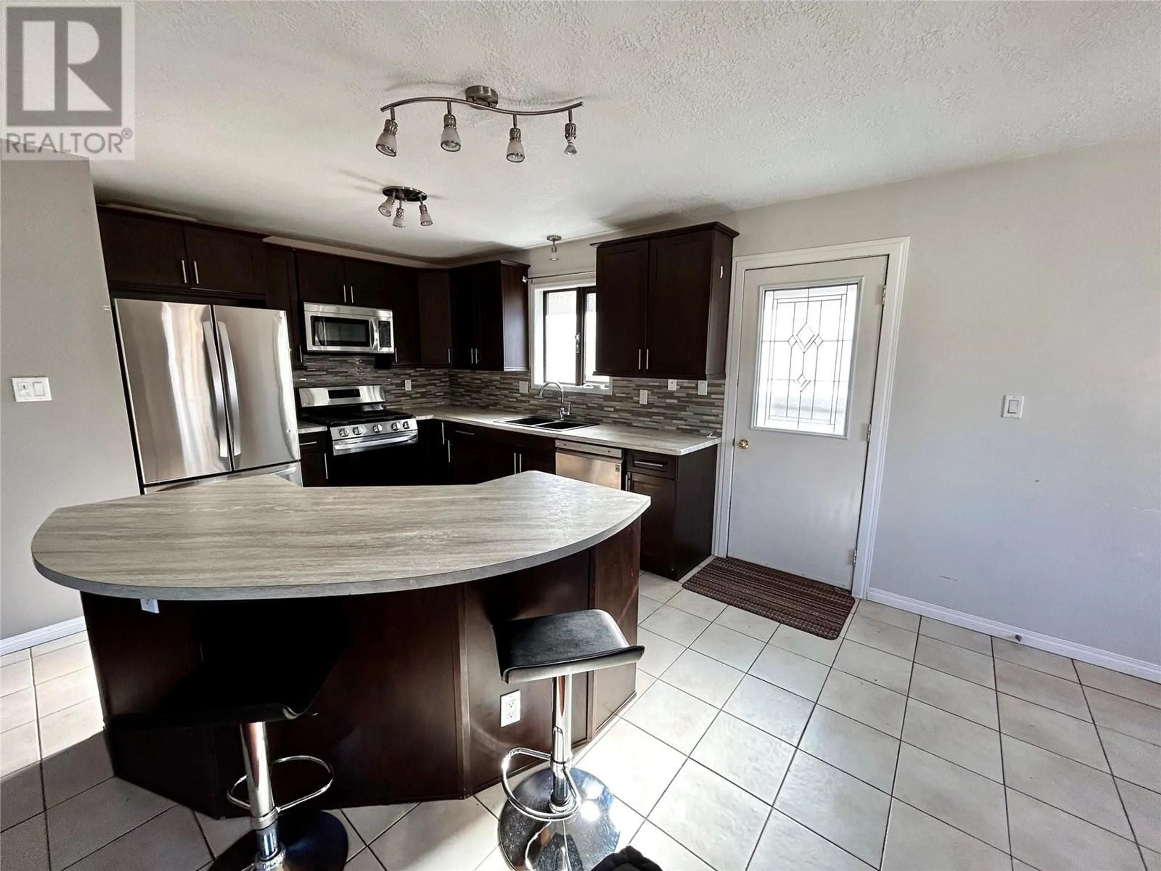 Open concept kitchen, ceramic/tile floor for 256 PEACE RIVER CRESCENT, Tumbler Ridge British Columbia V0C2W0