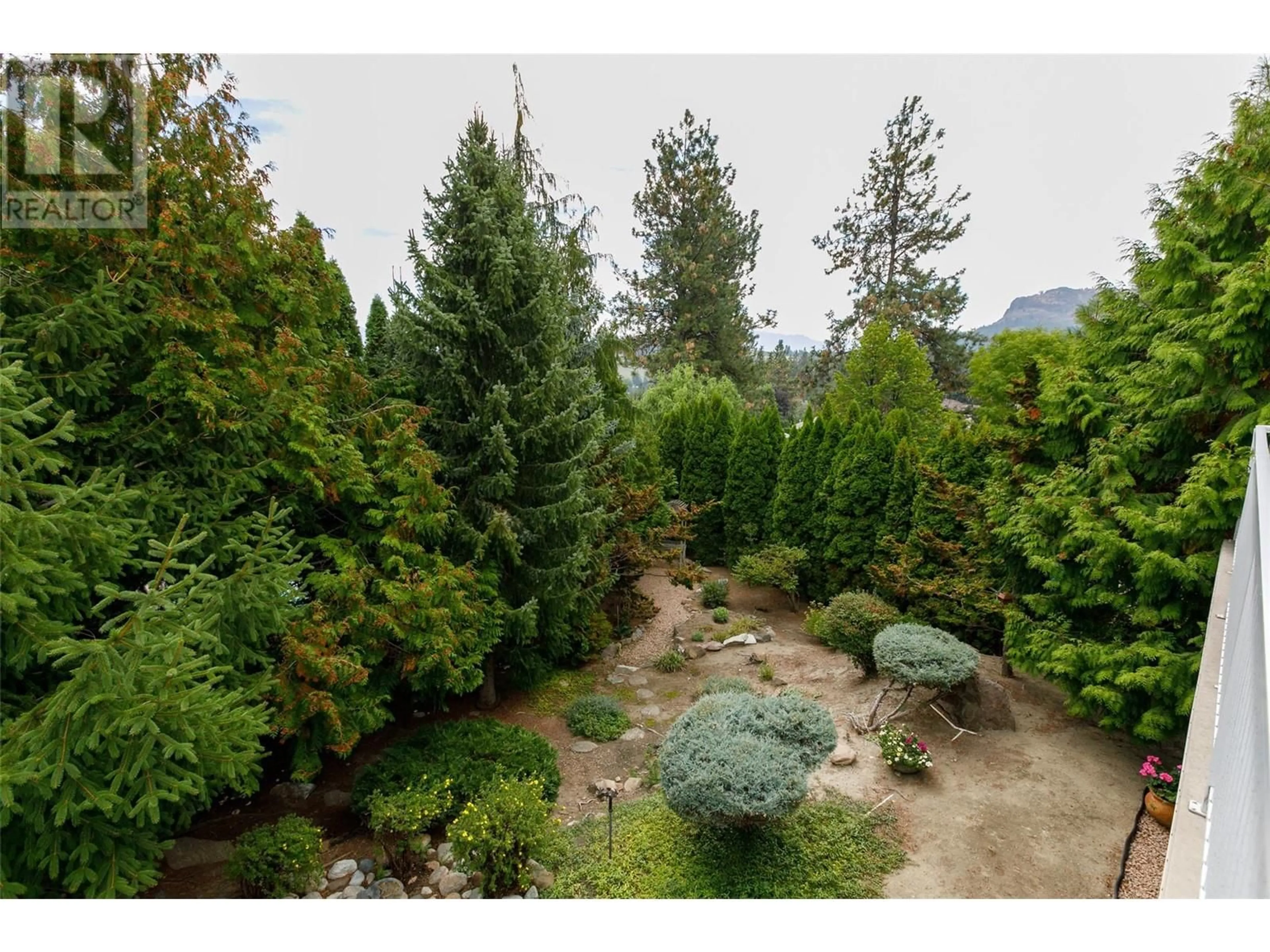 A pic from outside/outdoor area/front of a property/back of a property/a pic from drone, forest/trees view for 1043 CALEDONIA WAY, West Kelowna British Columbia V1Z3N7