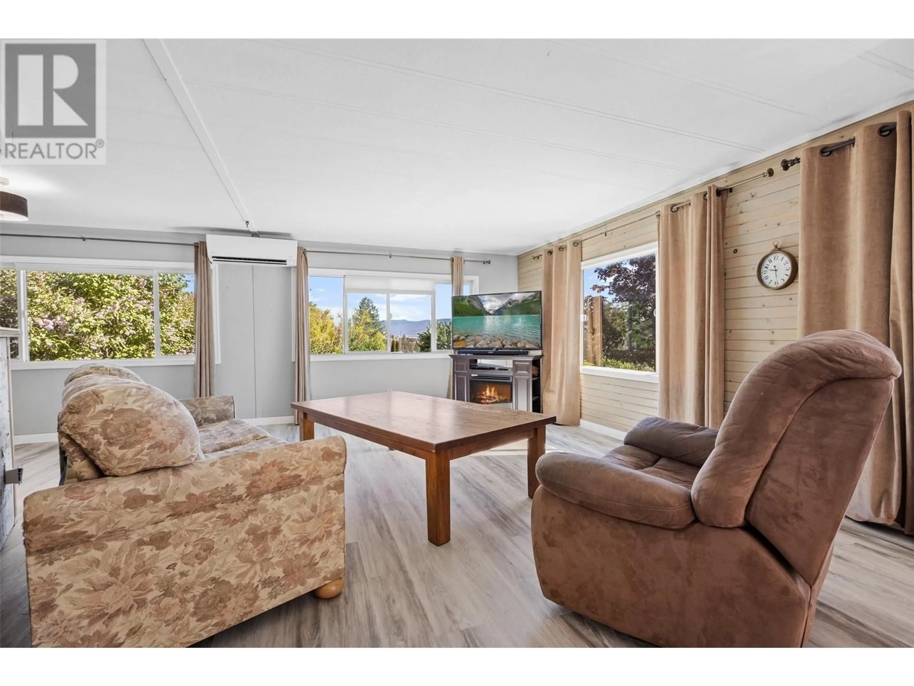 Living room with furniture, wood/laminate floor for 24 - 201 HIGHWAY 97 HIGHWAY, Penticton British Columbia V2A0E4