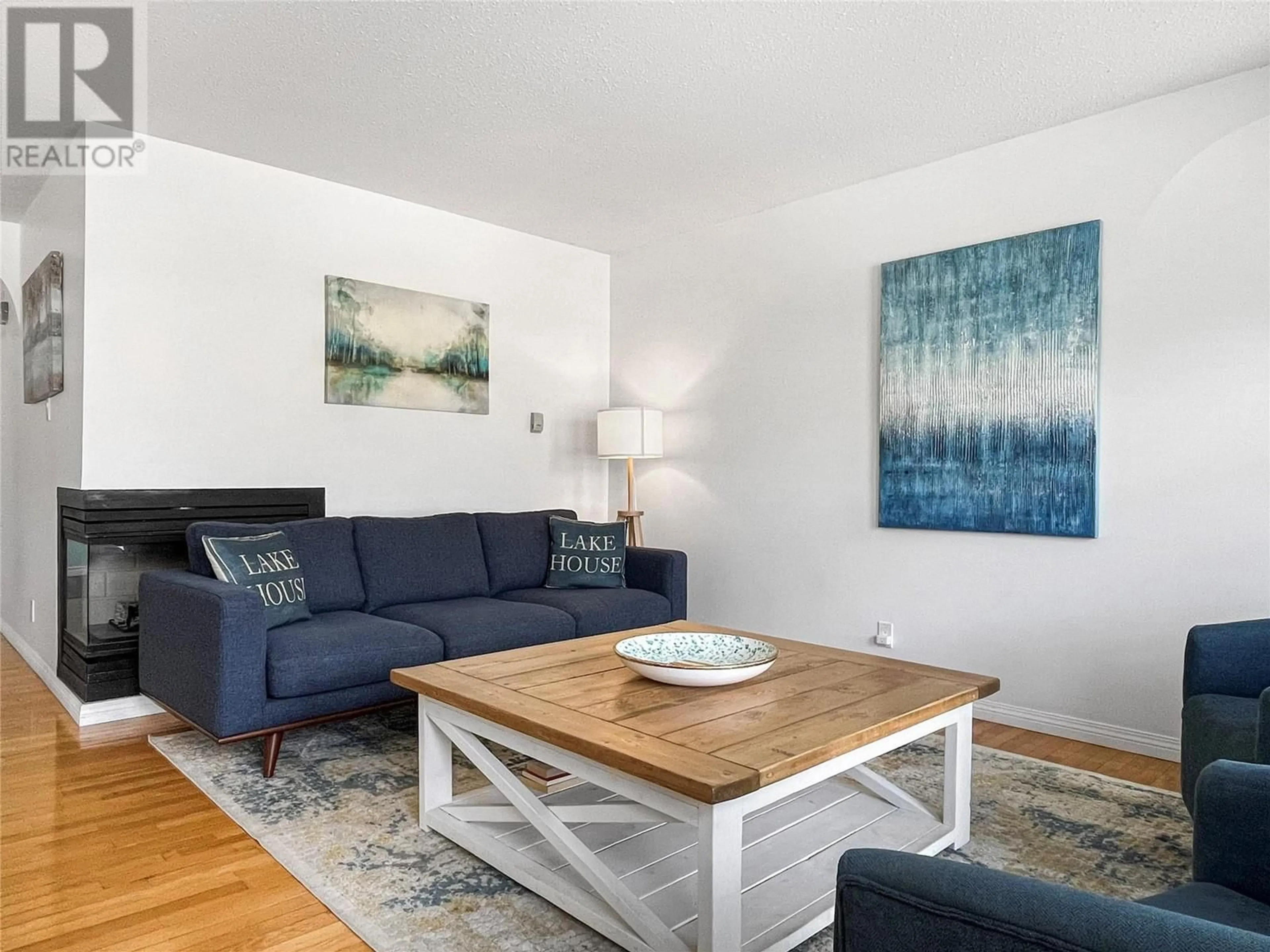Living room with furniture, wood/laminate floor for 5814 OLEANDER DRIVE, Osoyoos British Columbia V0H1V1