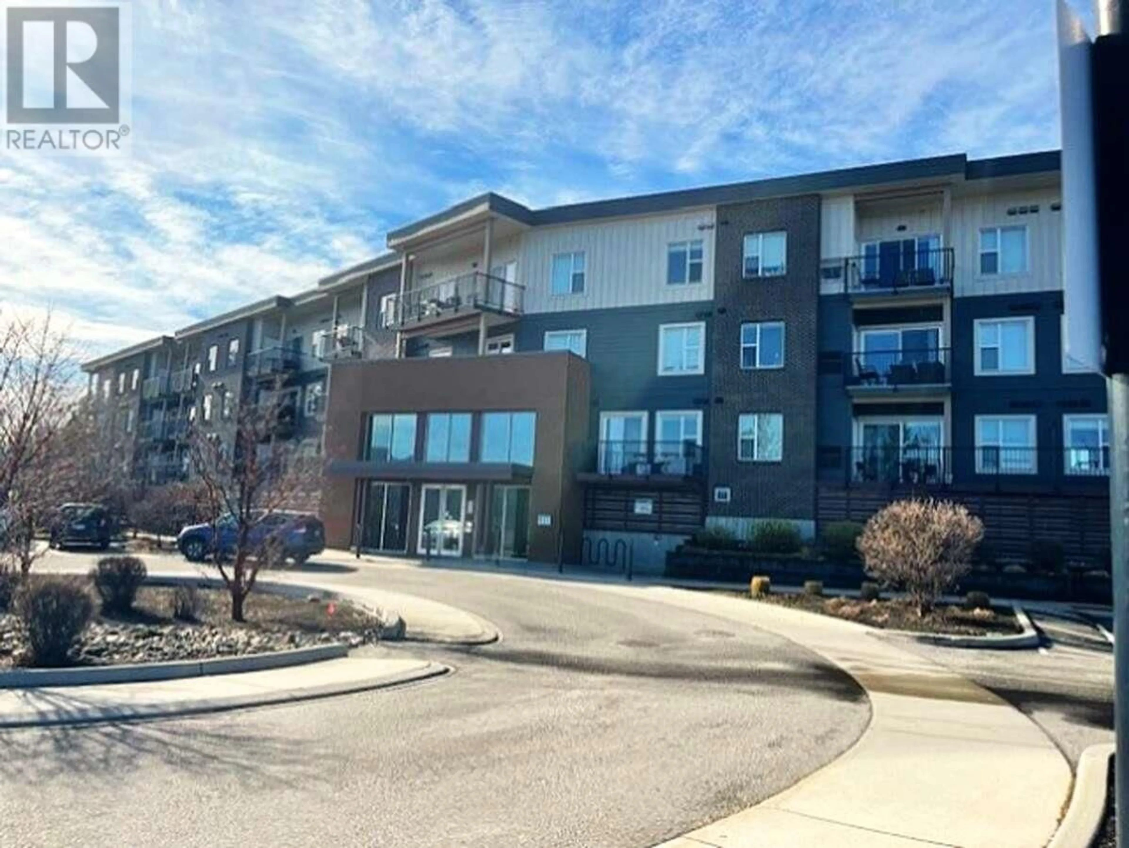 A pic from outside/outdoor area/front of a property/back of a property/a pic from drone, building for 207 - 935 ACADEMY WAY, Kelowna British Columbia V1V3C9